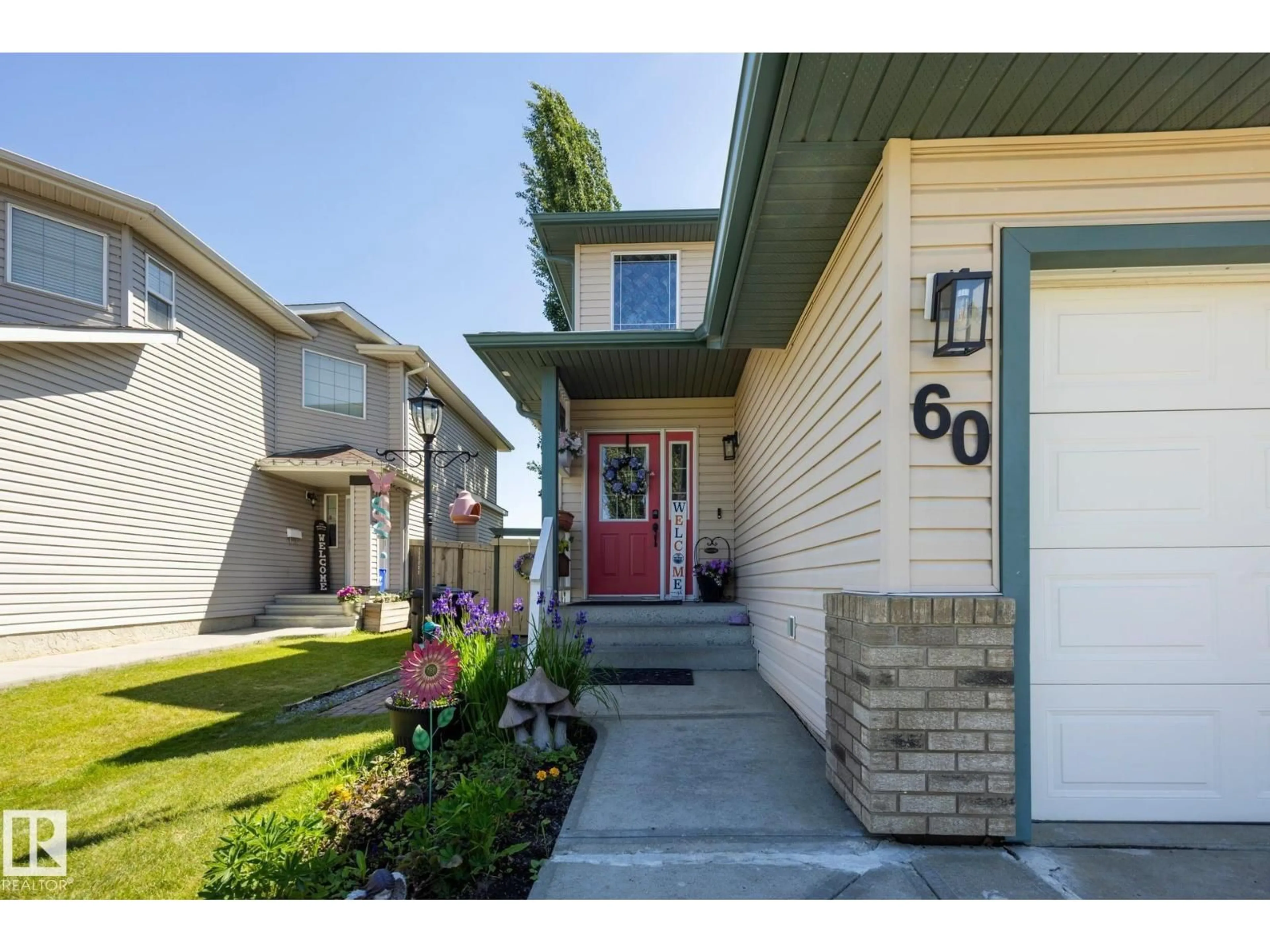 Home with vinyl exterior material, street for 60 LEYLAND WY, Spruce Grove Alberta T7X4P2