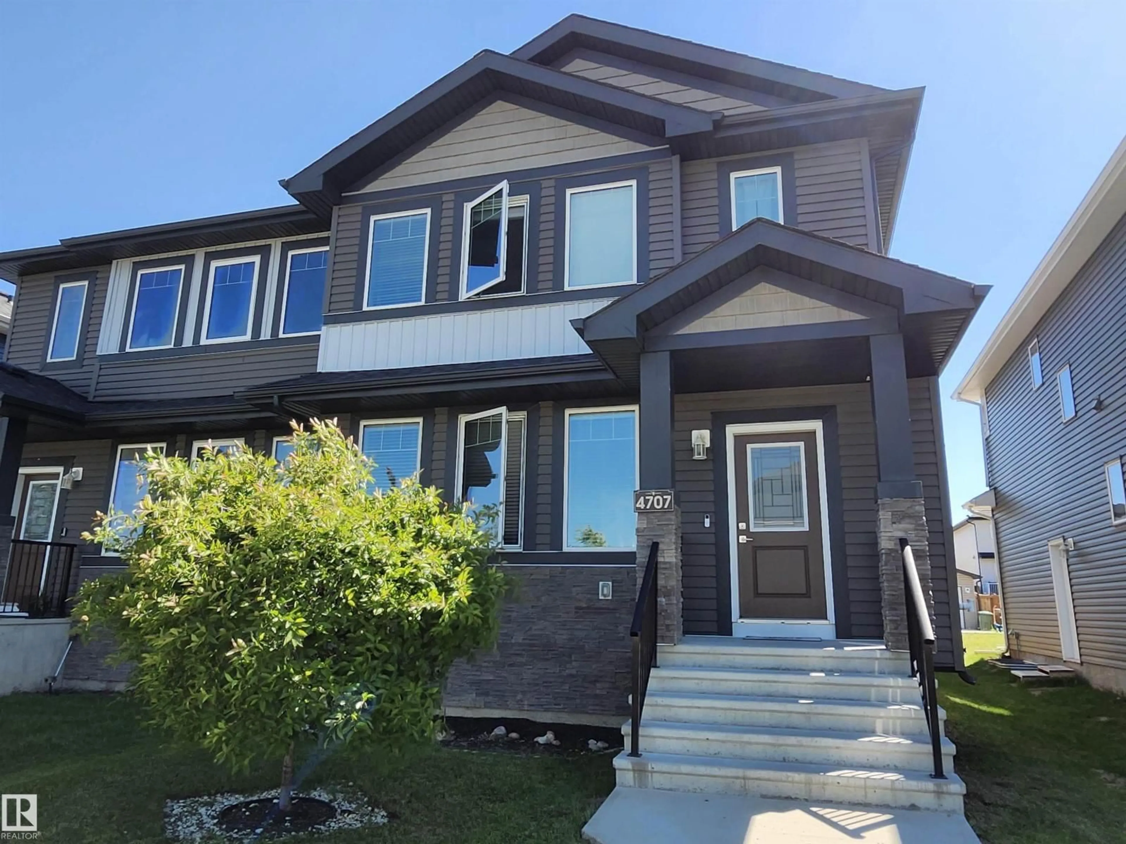 Home with vinyl exterior material, street for 4707 36 ST, Beaumont Alberta T4X2C3