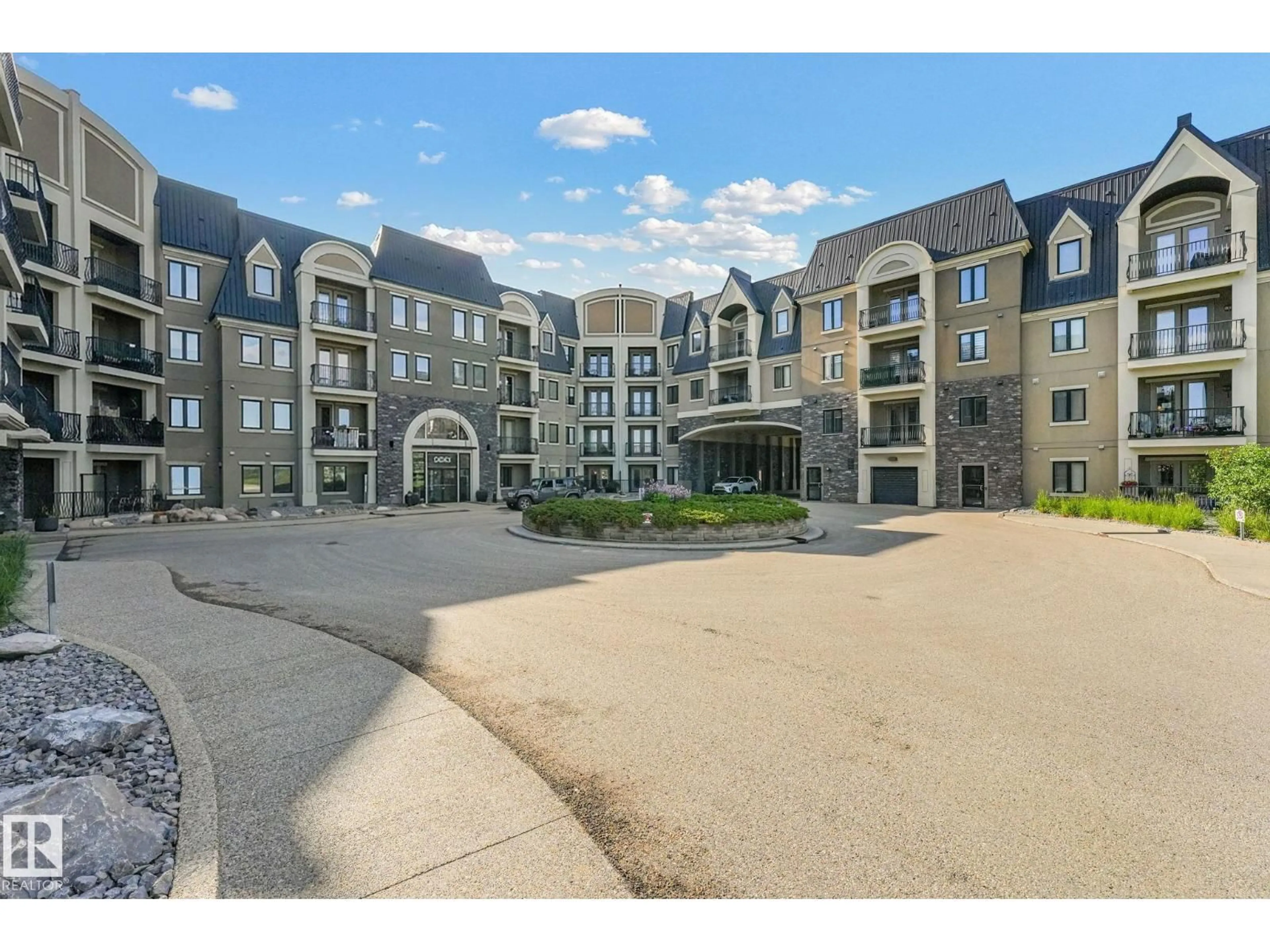 A pic from outside/outdoor area/front of a property/back of a property/a pic from drone, water/lake/river/ocean view for #403 - 6083 MAYNARD WY, Edmonton Alberta T6R0S5