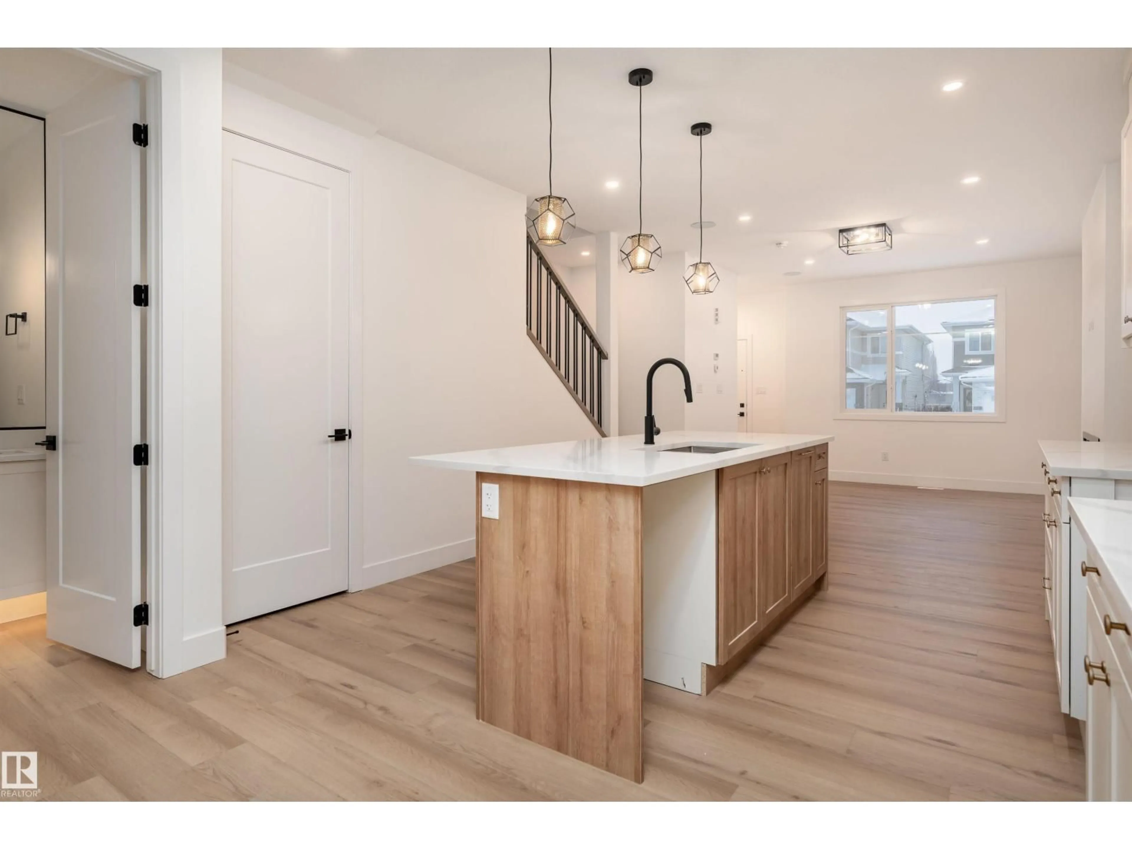 Open concept kitchen, wood/laminate floor for 535 ROBINSON BV, Leduc Alberta T9E1P8