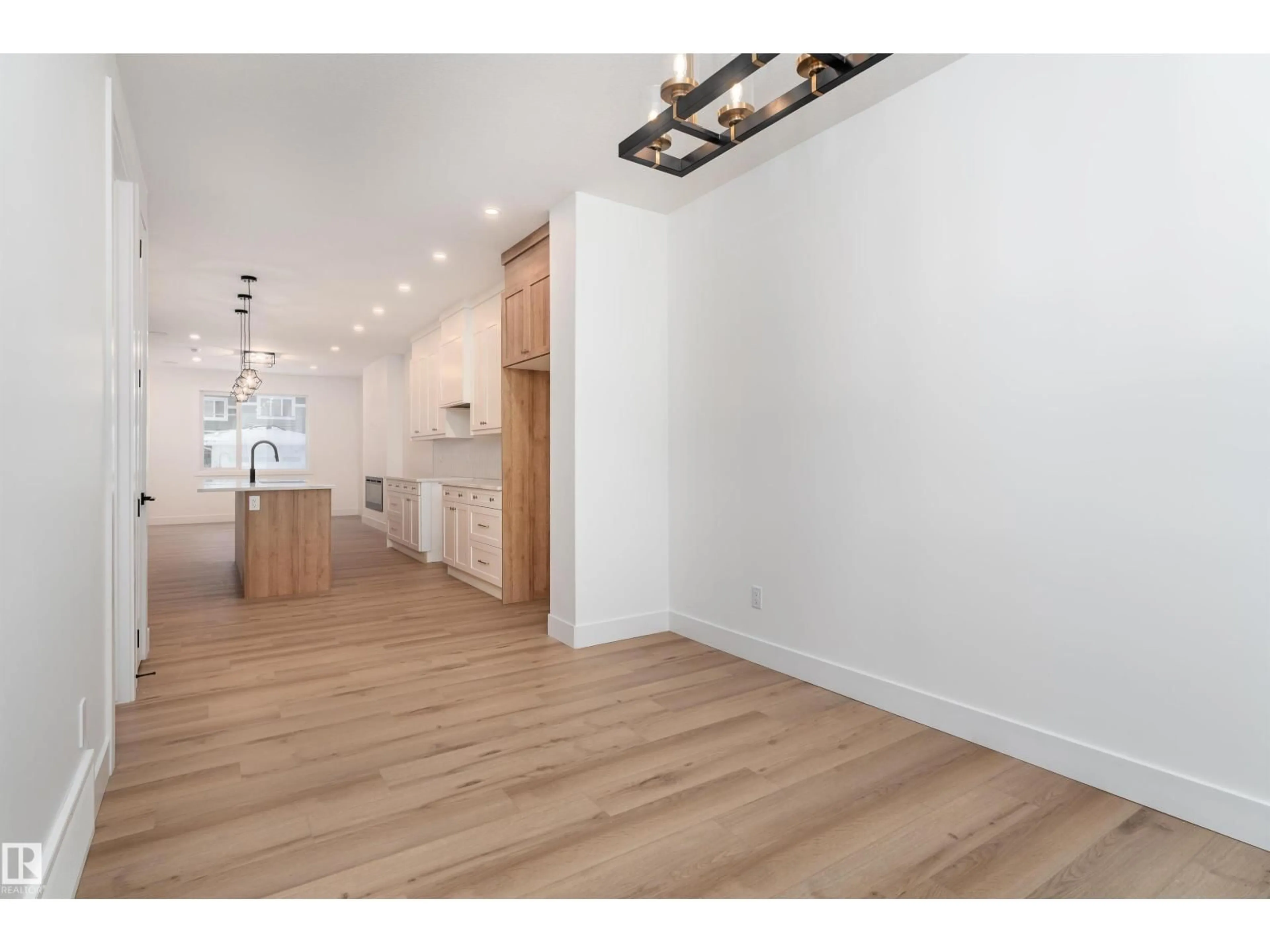Open concept kitchen, wood/laminate floor for 535 ROBINSON BV, Leduc Alberta T9E1P8