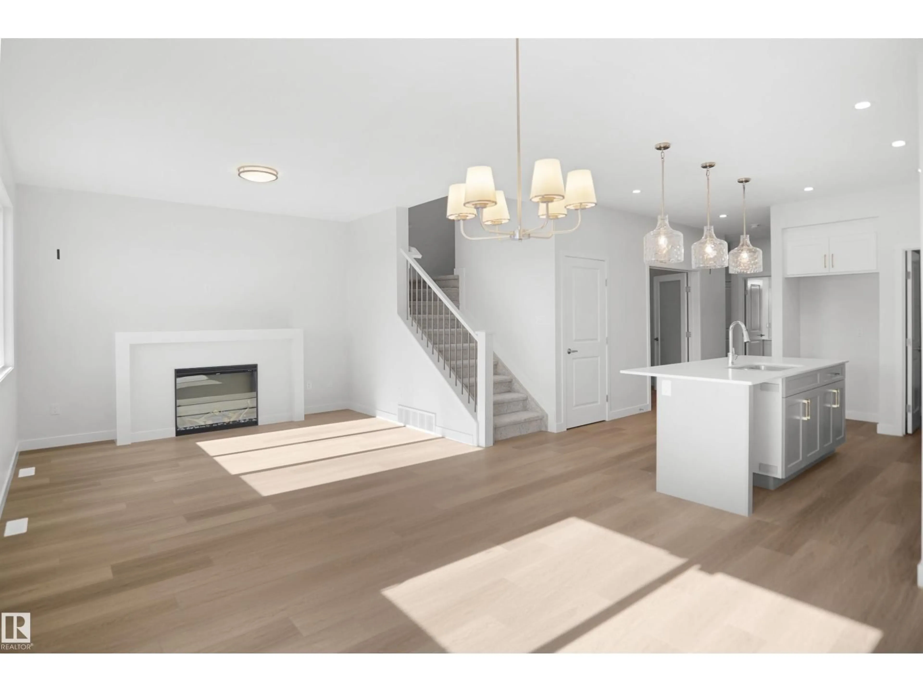 Open concept kitchen, wood/laminate floor for 1631 11 AV, Edmonton Alberta T6T2S5
