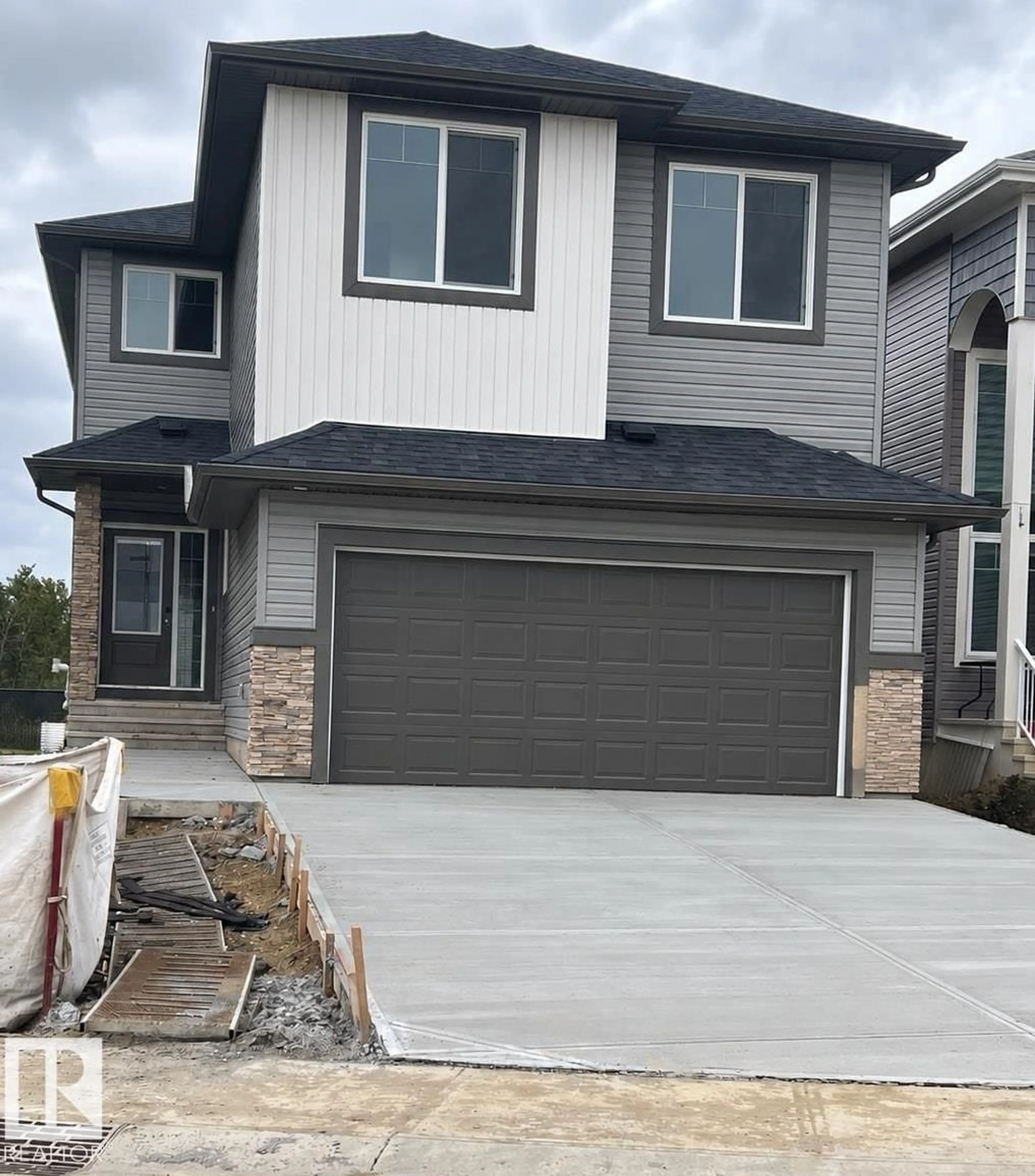 Home with vinyl exterior material, street for 1209 11 AV, Edmonton Alberta T6T2W3
