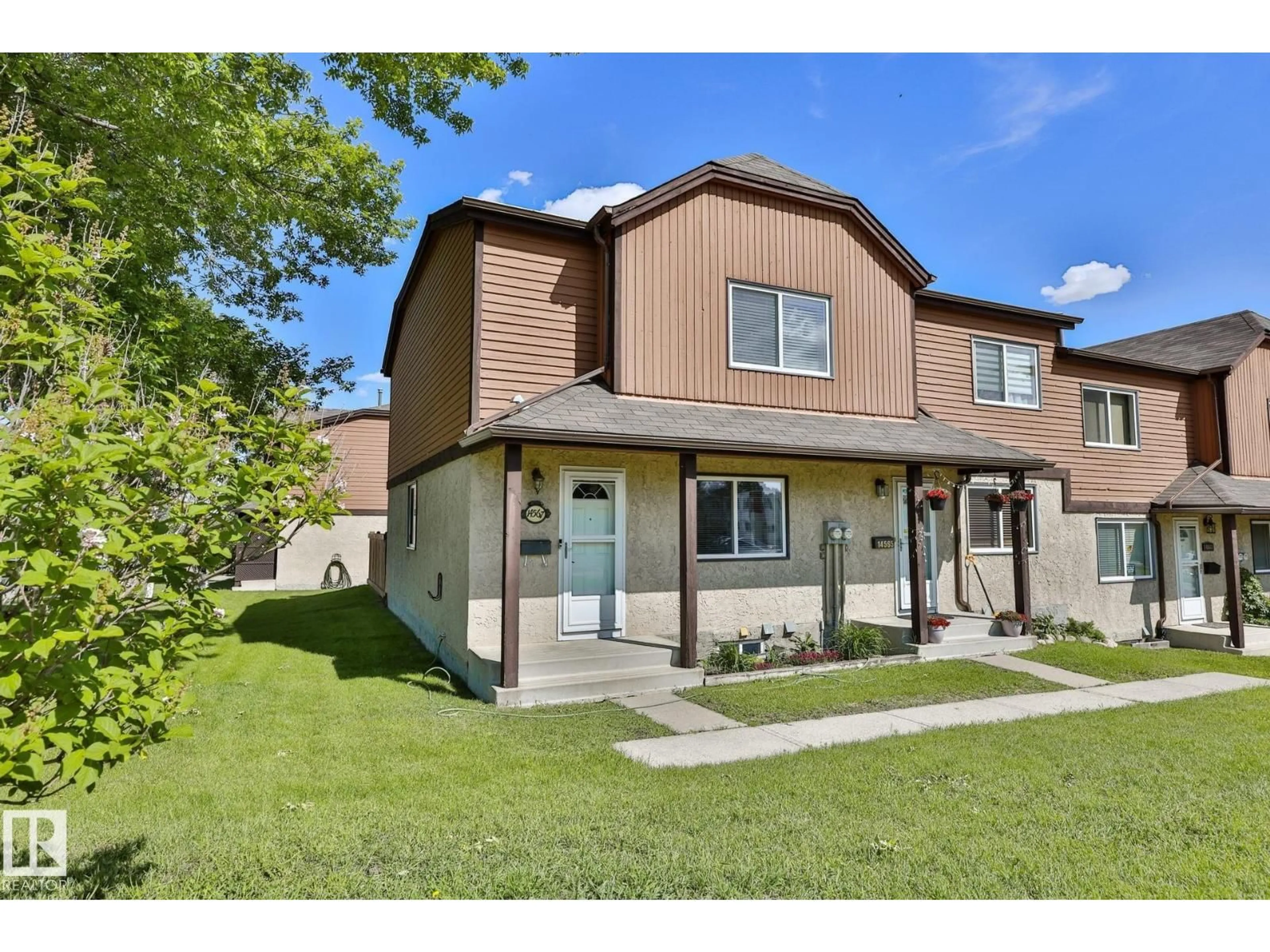 Home with vinyl exterior material, street for 14567 52 ST, Edmonton Alberta T5A4N1