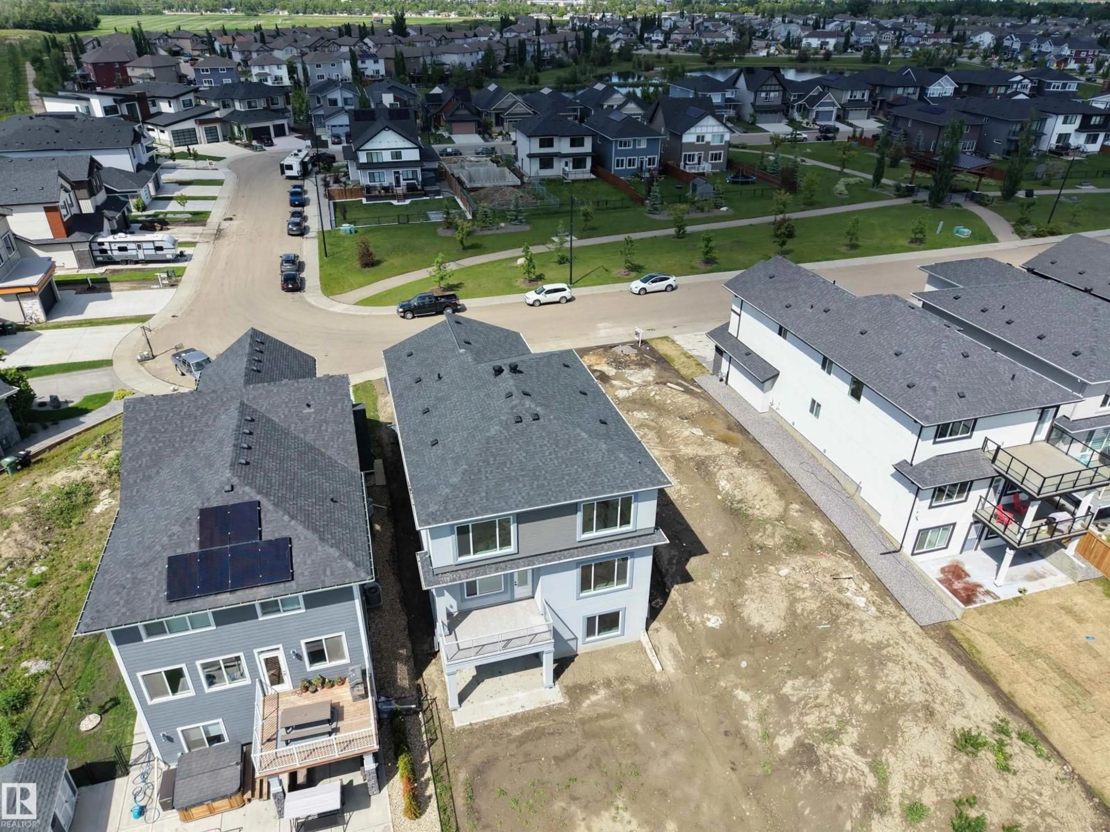 A pic from outside/outdoor area/front of a property/back of a property/a pic from drone, street for 132 EDGEWATER CI, Leduc Alberta T9E1K5