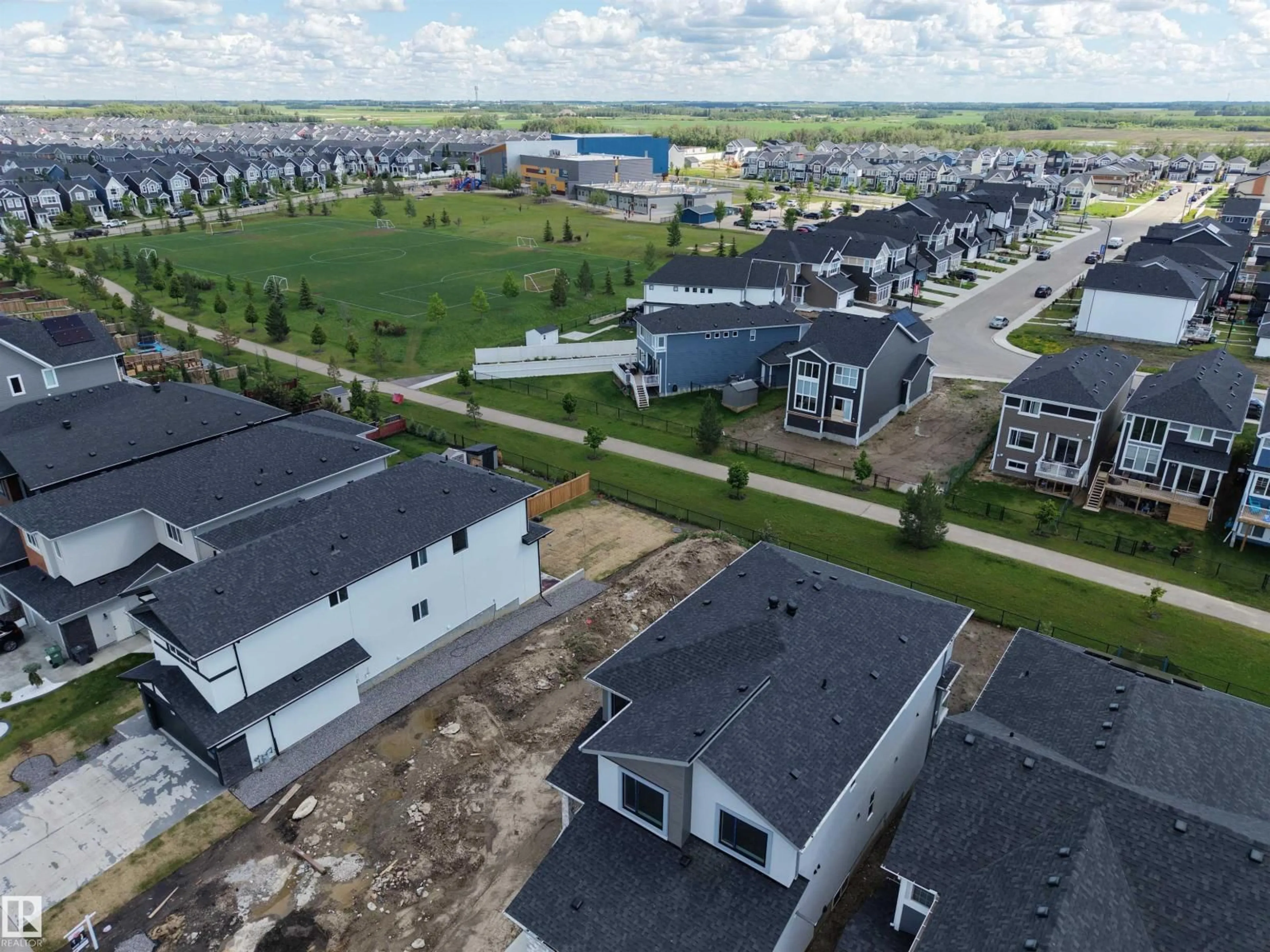 A pic from outside/outdoor area/front of a property/back of a property/a pic from drone, street for 132 EDGEWATER CI, Leduc Alberta T9E1K5