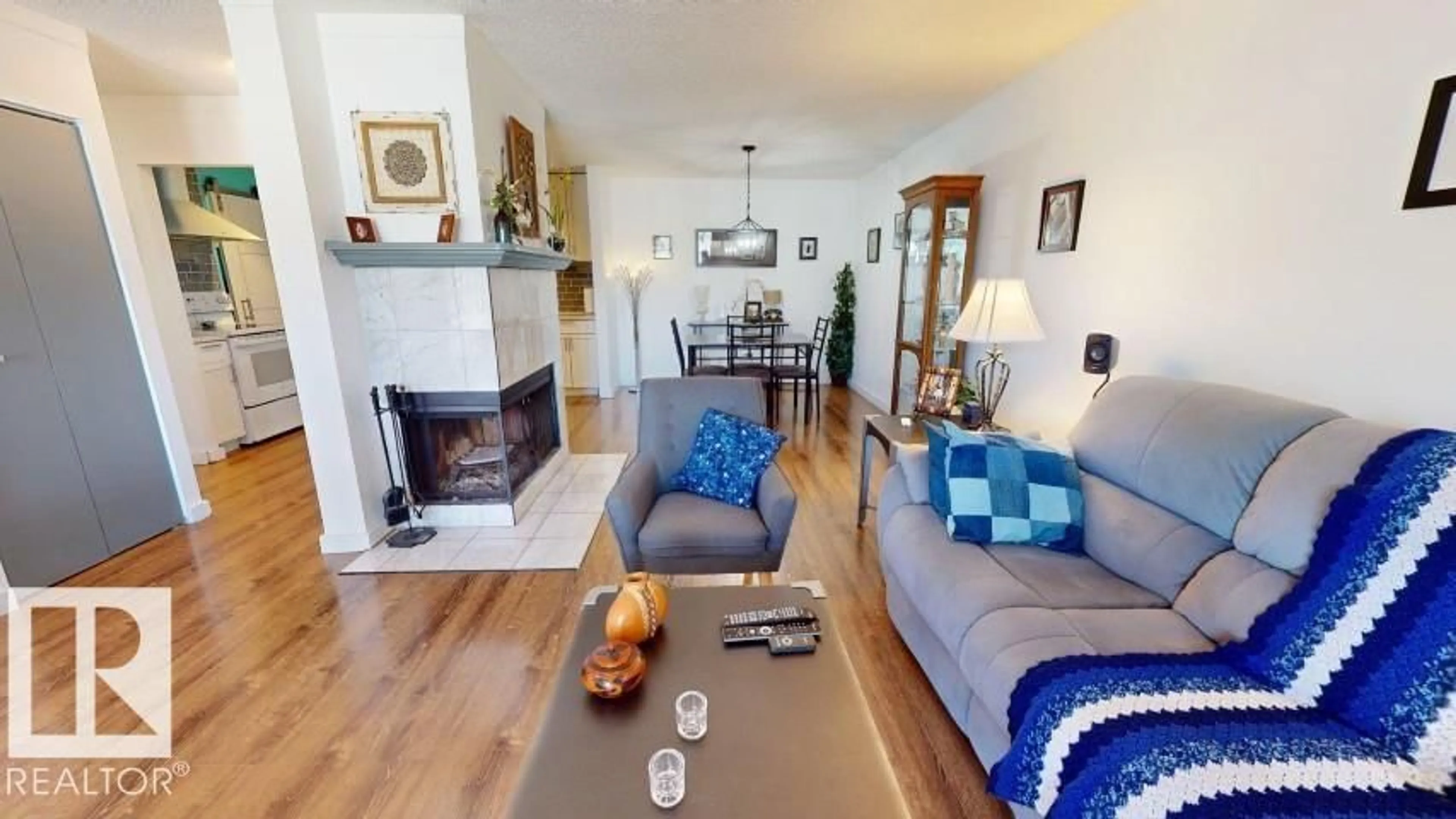 Living room with furniture, wood/laminate floor for Unit 73 - 2703 79 ST, Edmonton Alberta T6K3Z6