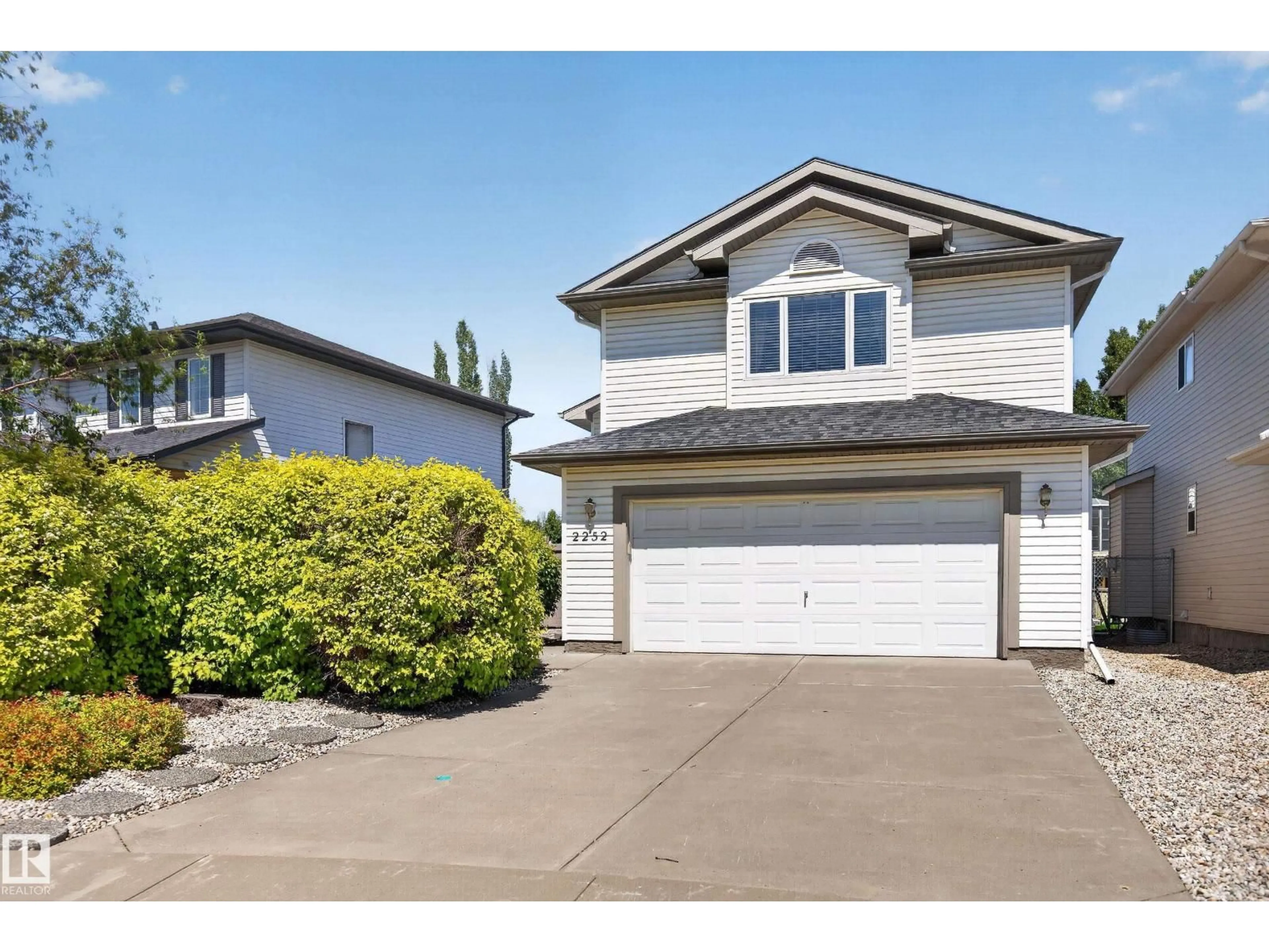 Home with vinyl exterior material, street for 2252 BRENNAN CO, Edmonton Alberta T5T6M3