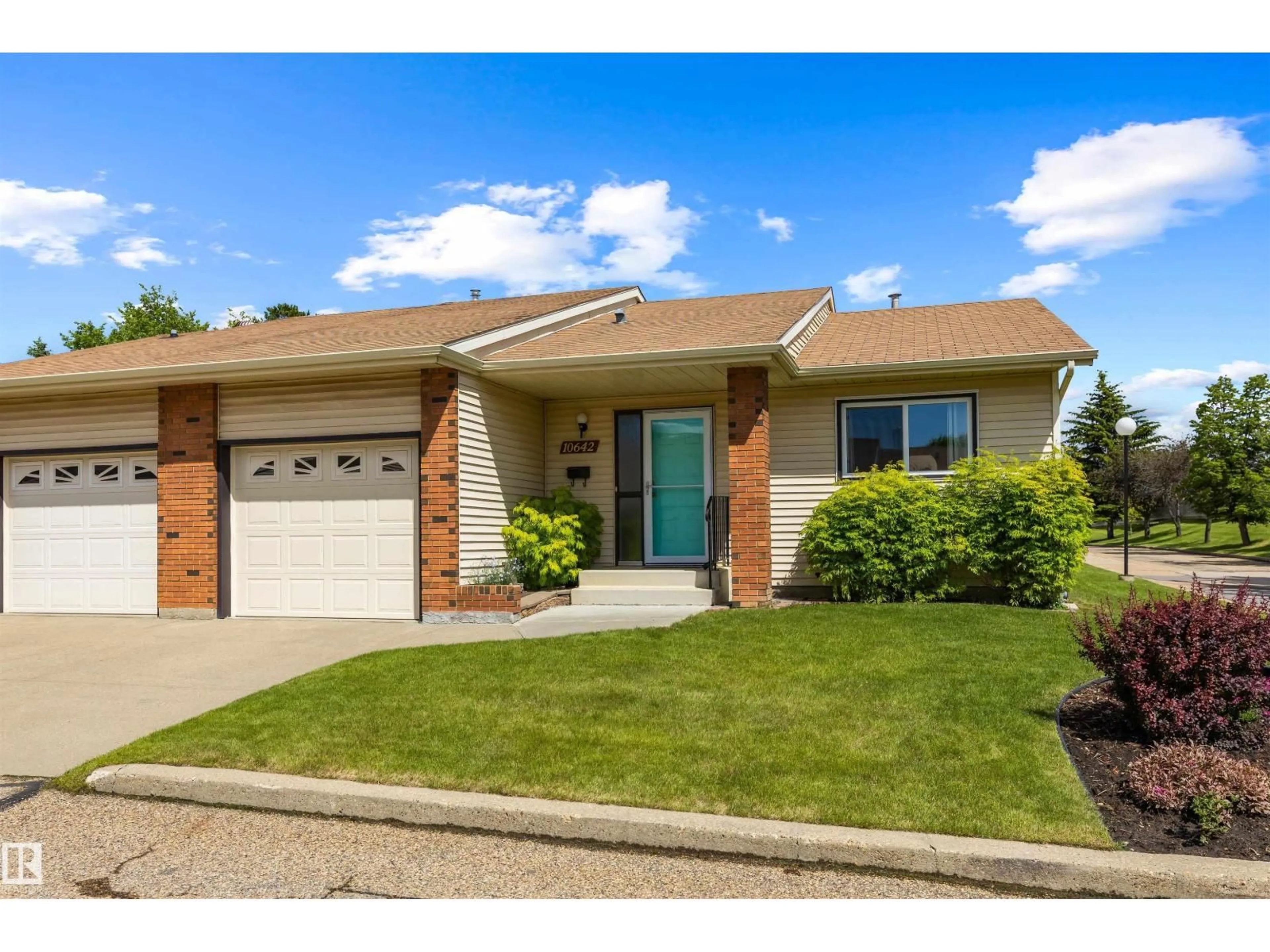 Home with brick exterior material, street for NW - 10642 153 AV, Edmonton Alberta T5X5R8