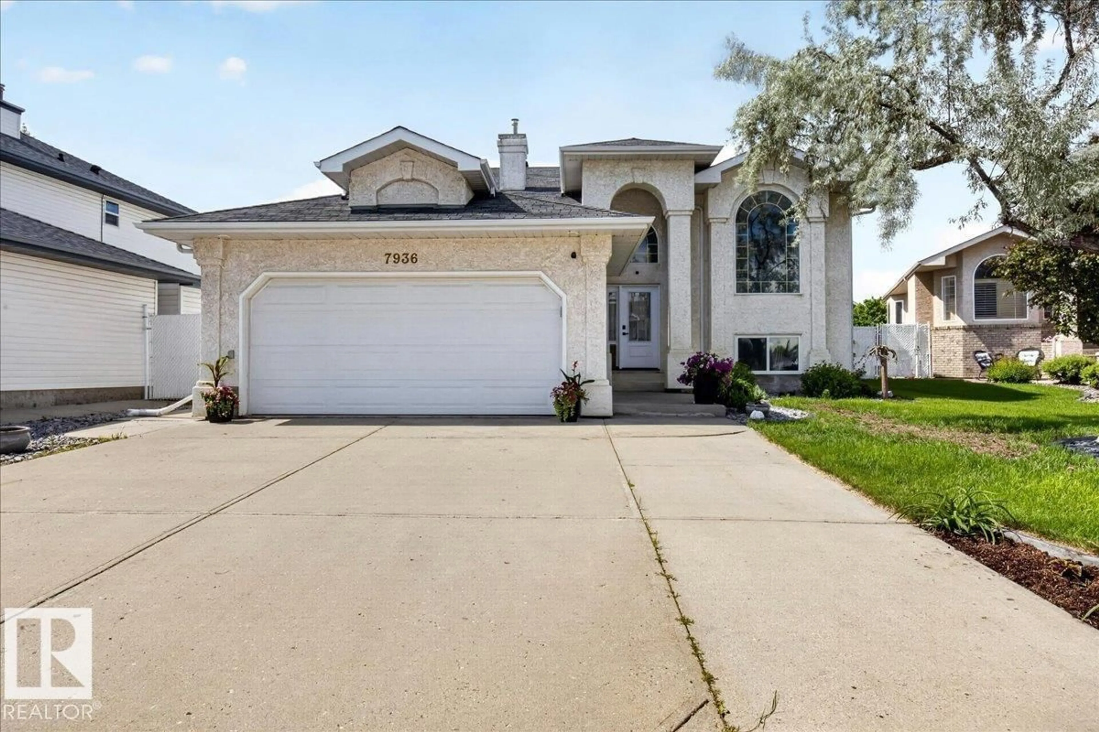 Home with vinyl exterior material, street for 7936 165 AV, Edmonton Alberta T5Z3J6