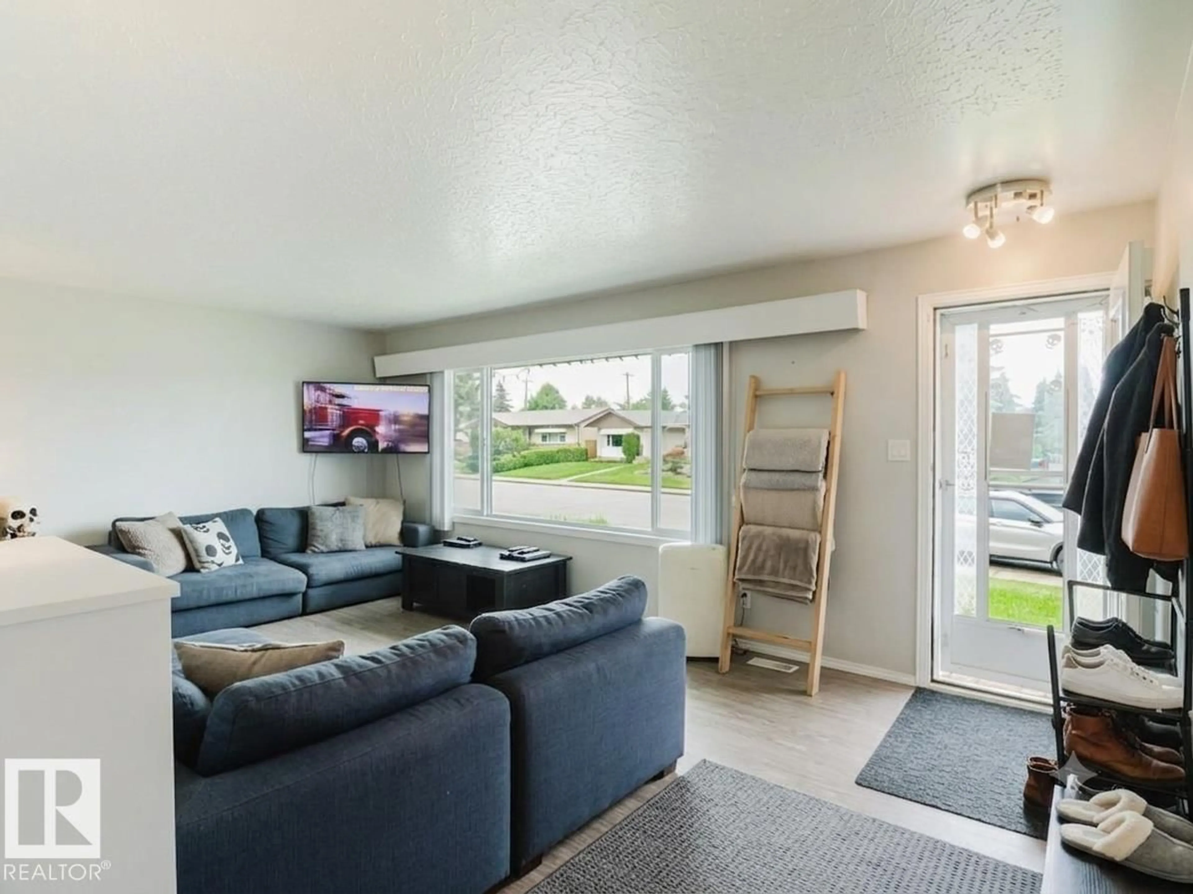 Living room with furniture, unknown for 7515 130 AV, Edmonton Alberta T5C1Y3