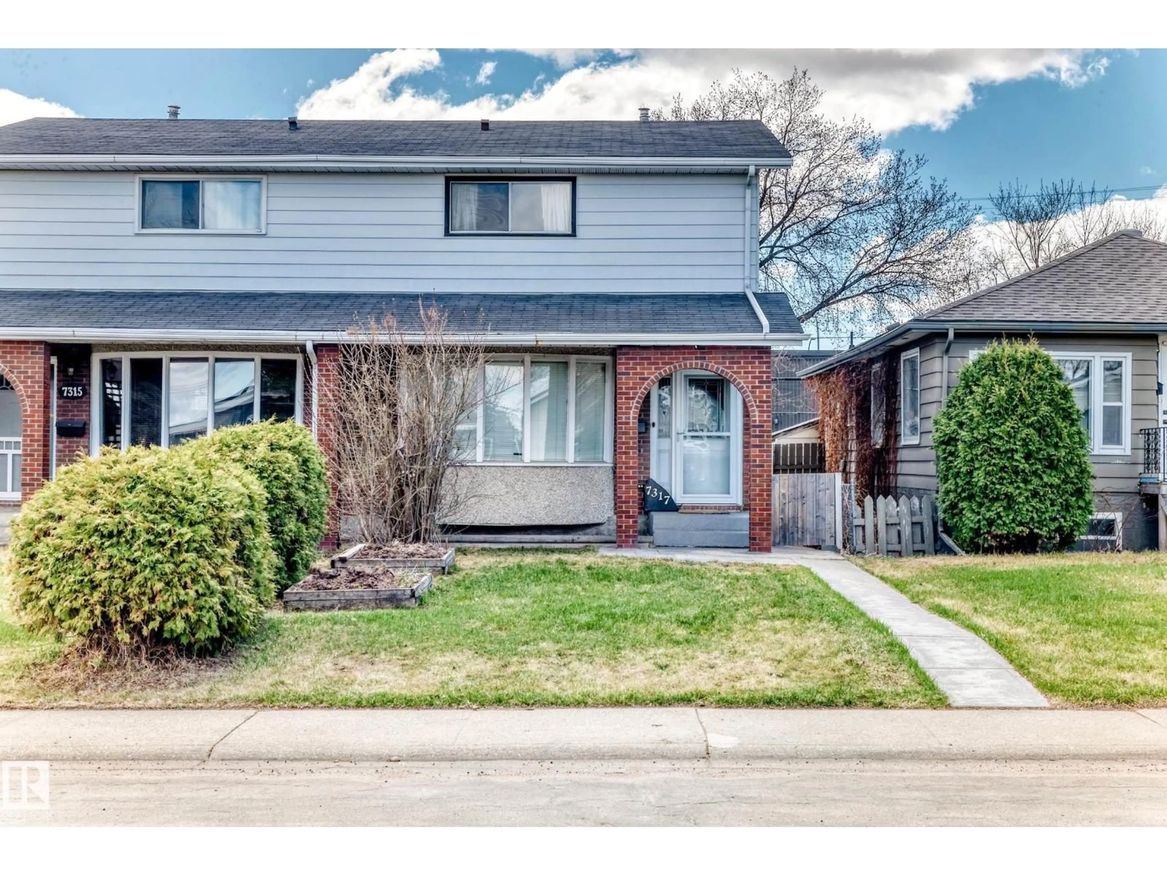 Home with brick exterior material, street for 7317 83 AV, Edmonton Alberta T6B0G8