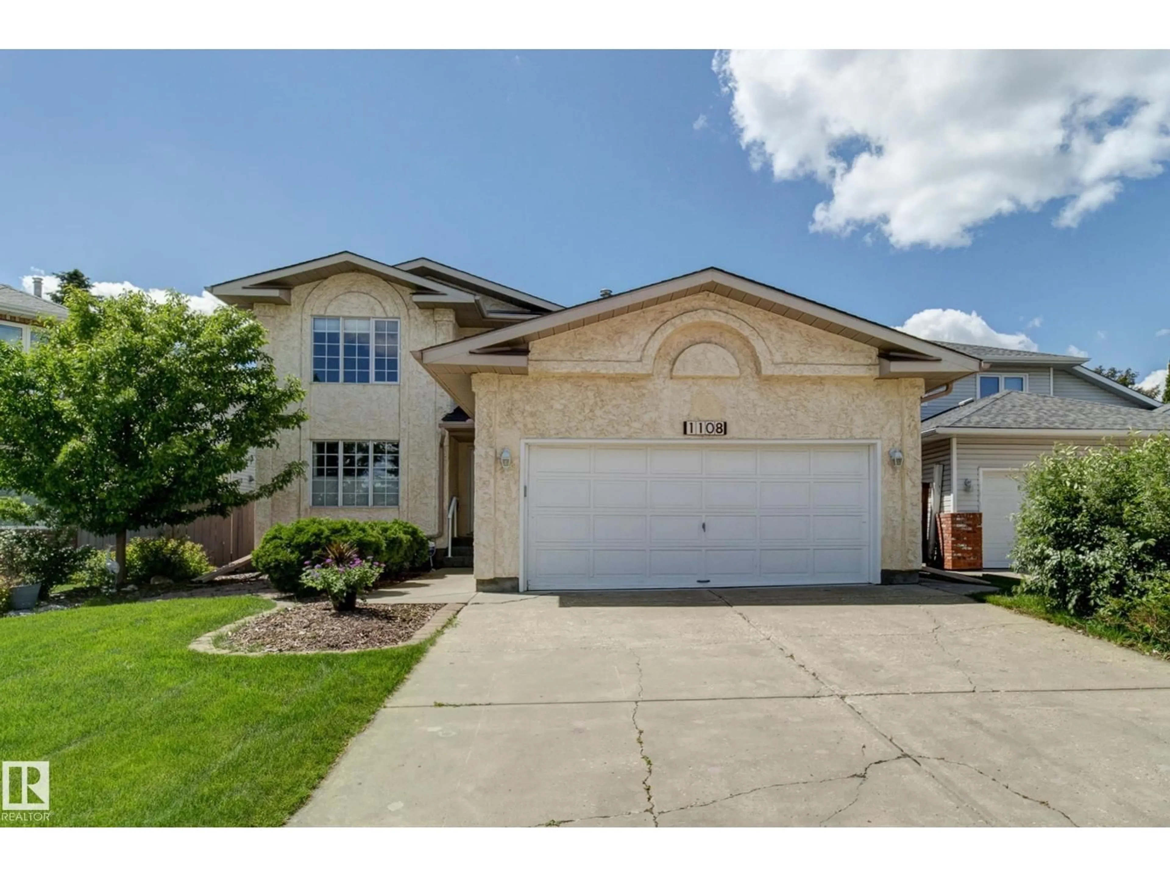 Home with vinyl exterior material, street for 1108 112A ST NW, Edmonton Alberta T6J6S1