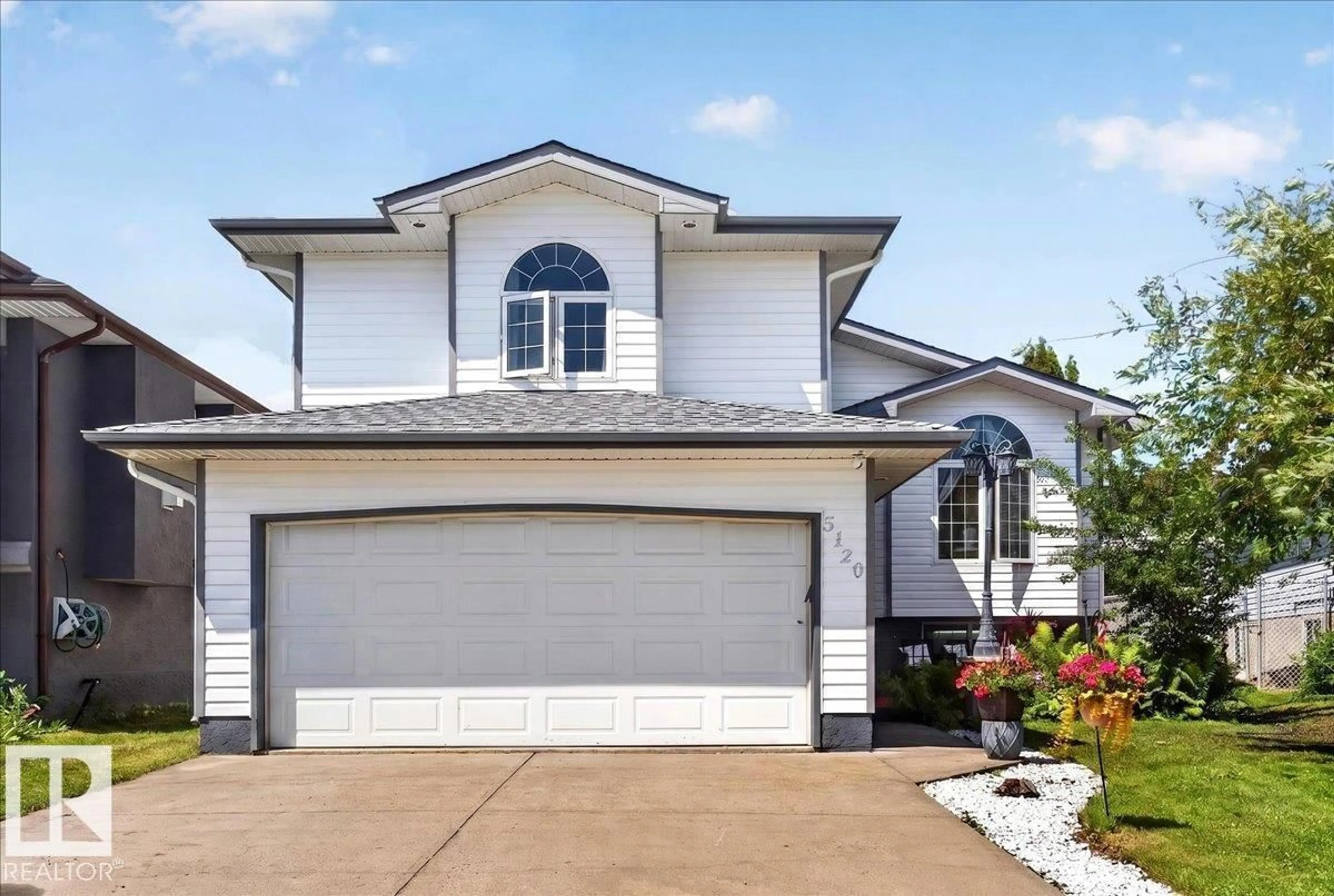 Home with vinyl exterior material, street for 5120 157 AV, Edmonton Alberta T5Y2X5