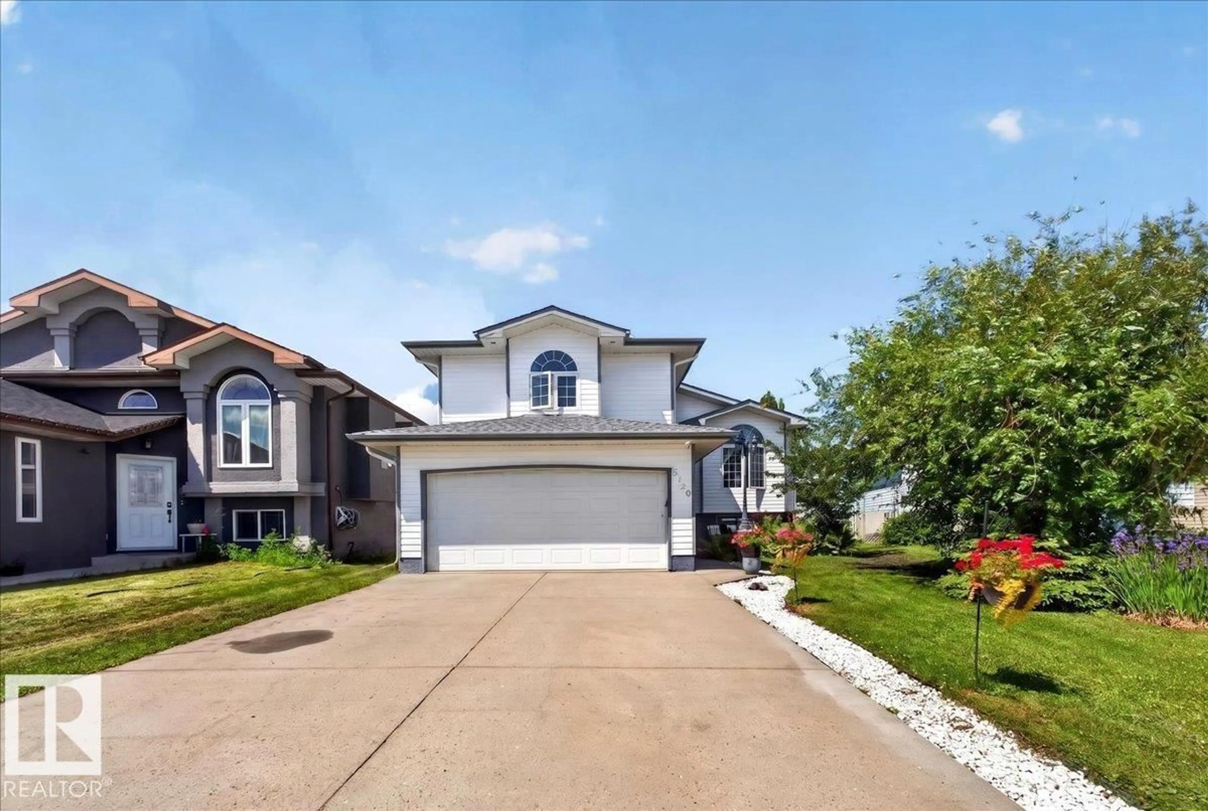Home with vinyl exterior material, street for 5120 157 AV, Edmonton Alberta T5Y2X5