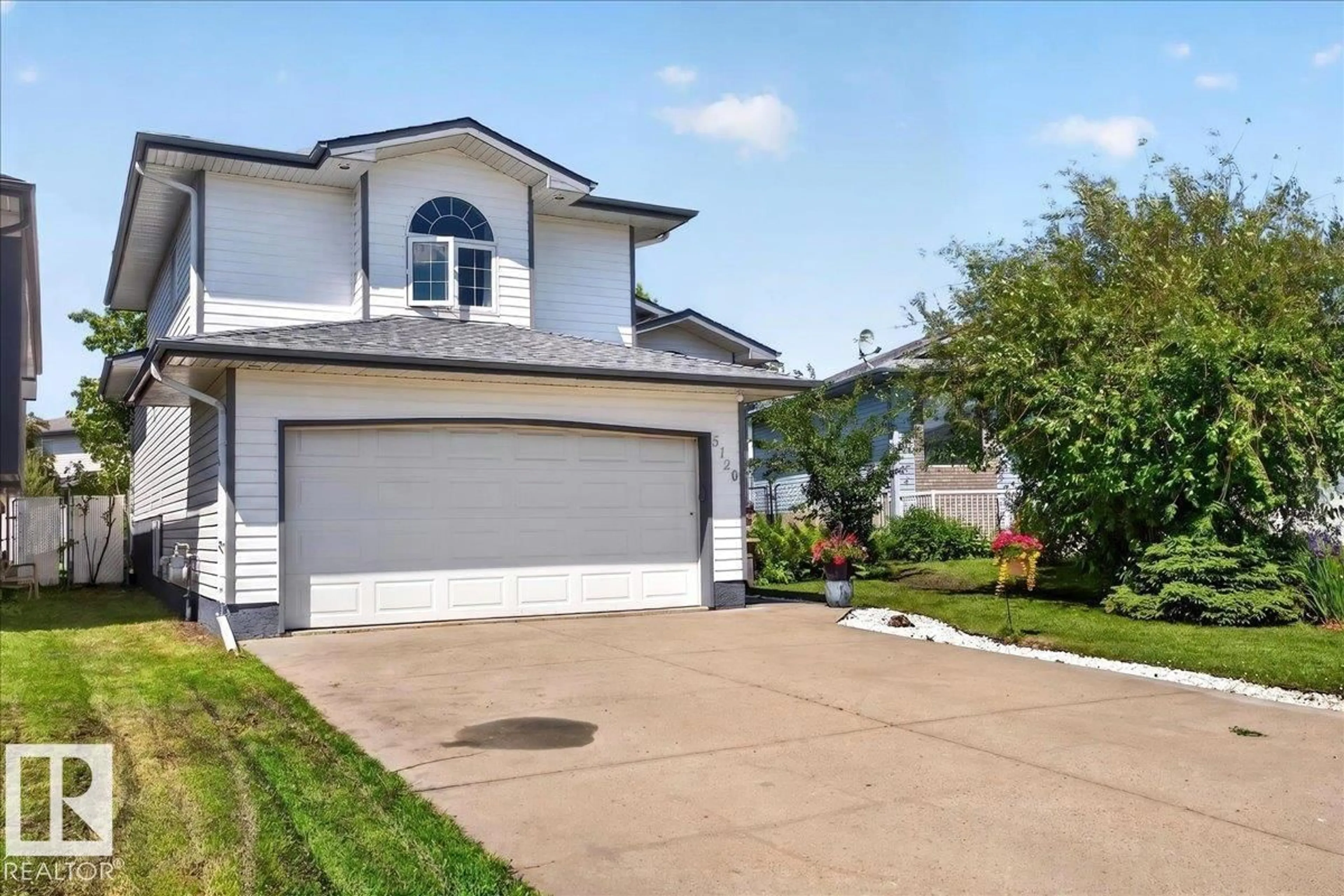 Home with vinyl exterior material, street for 5120 157 AV, Edmonton Alberta T5Y2X5