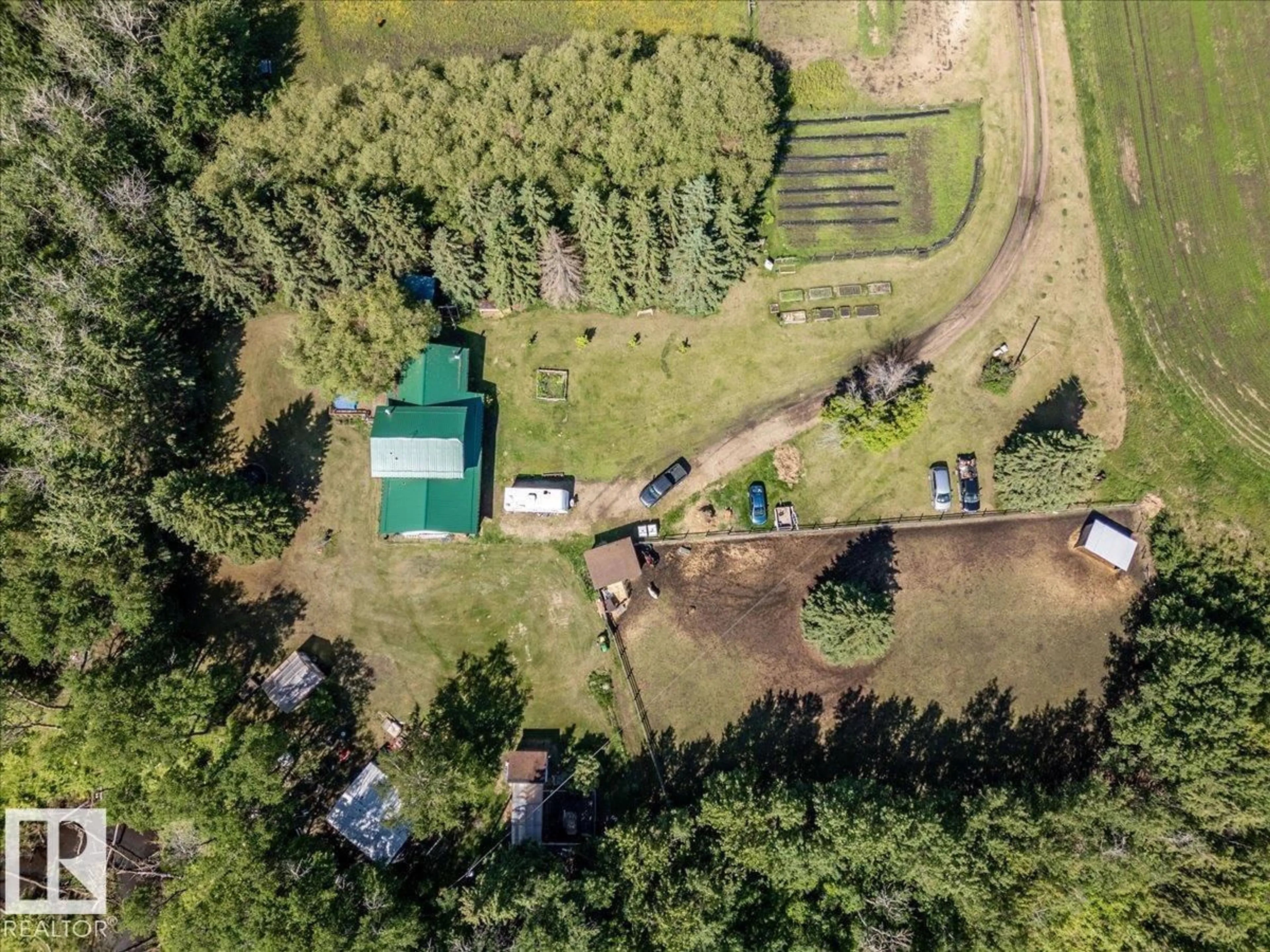 A pic from outside/outdoor area/front of a property/back of a property/a pic from drone, forest/trees view for 50279 RGE RD 274, Rural Leduc County Alberta T0C0V0