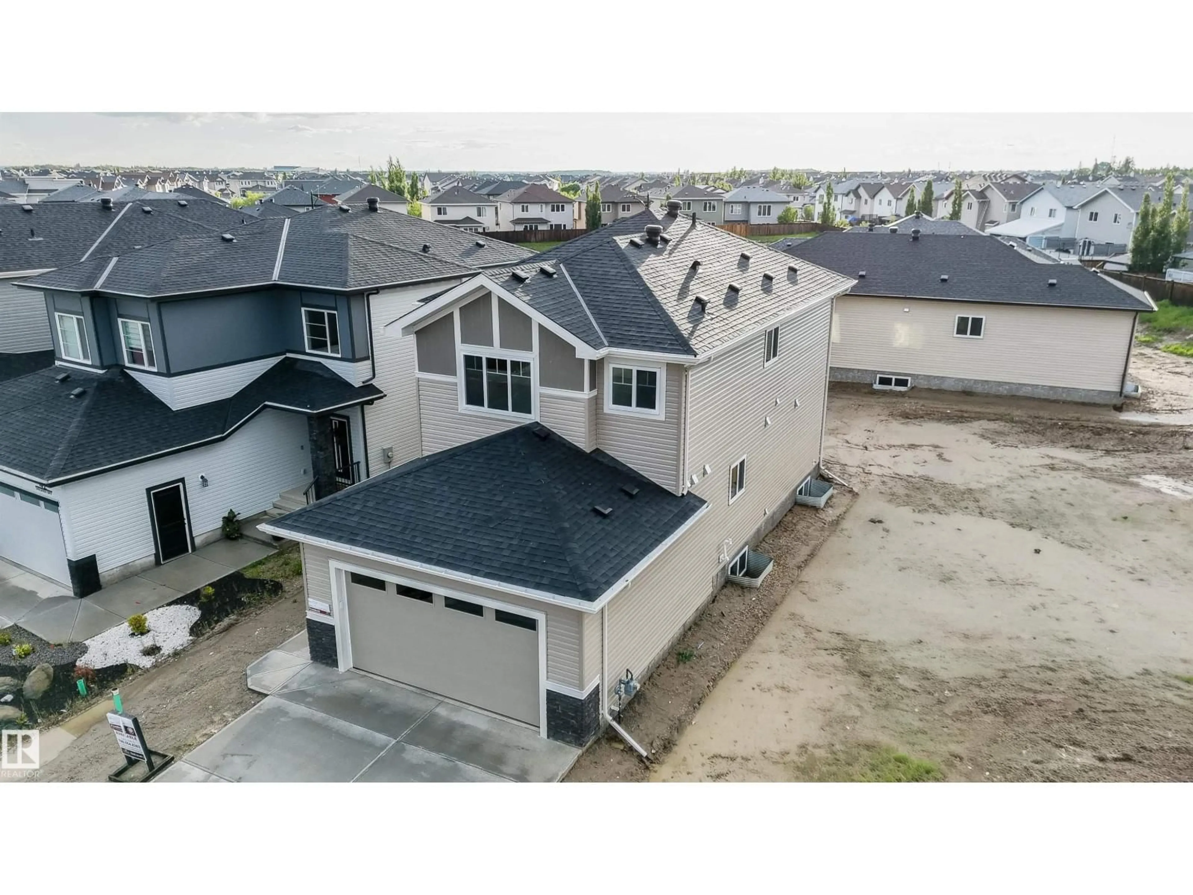 A pic from outside/outdoor area/front of a property/back of a property/a pic from drone, unknown for 44 DALQUIST BAY, Leduc Alberta T9E1N7