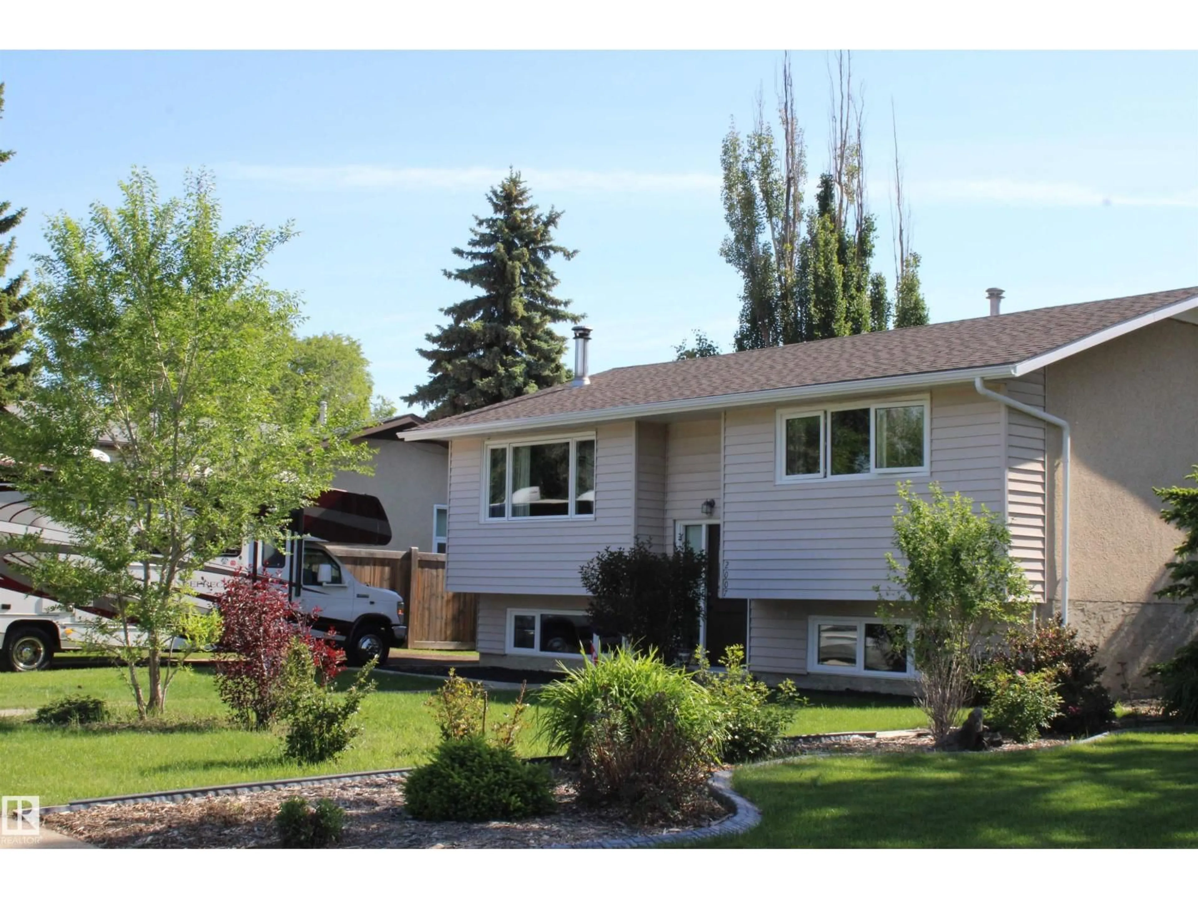 Home with vinyl exterior material, street for NW - 2007 67 ST, Edmonton Alberta T6K2H7