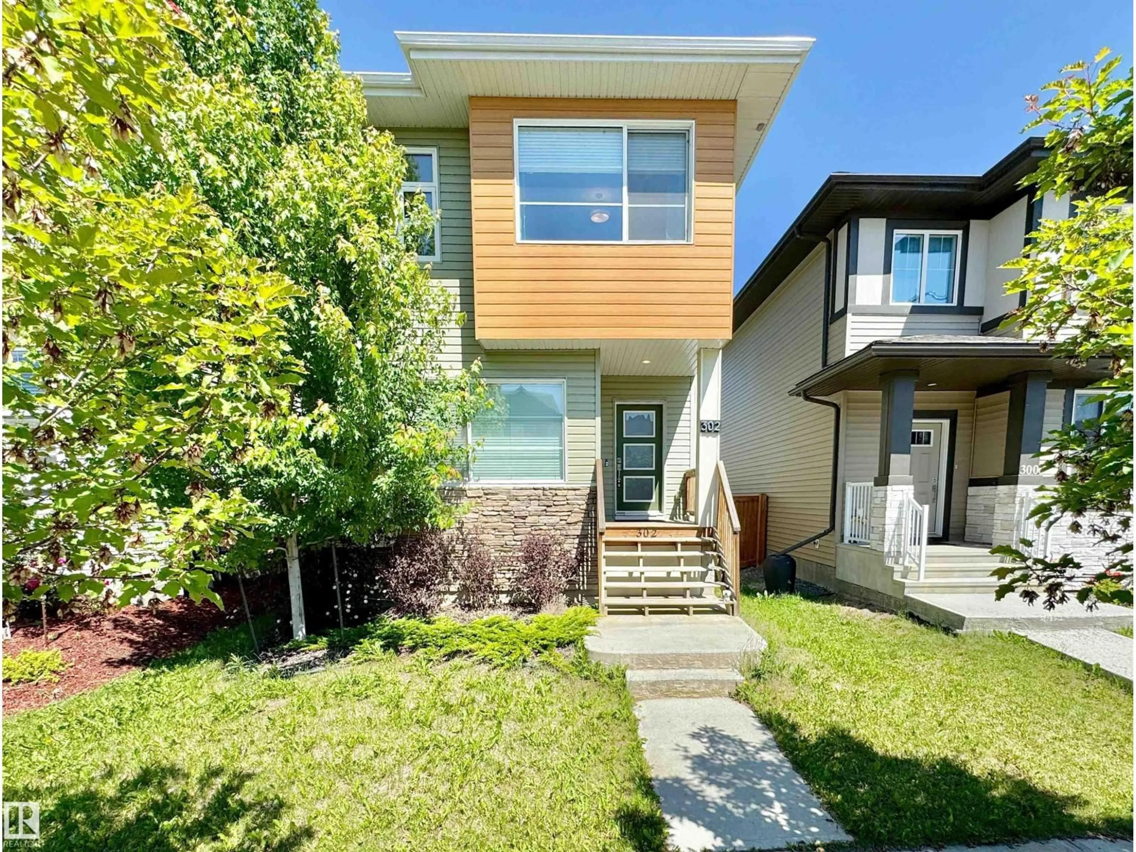 Home with vinyl exterior material, street for 302 BALSAM LI, Leduc Alberta T9E1L2