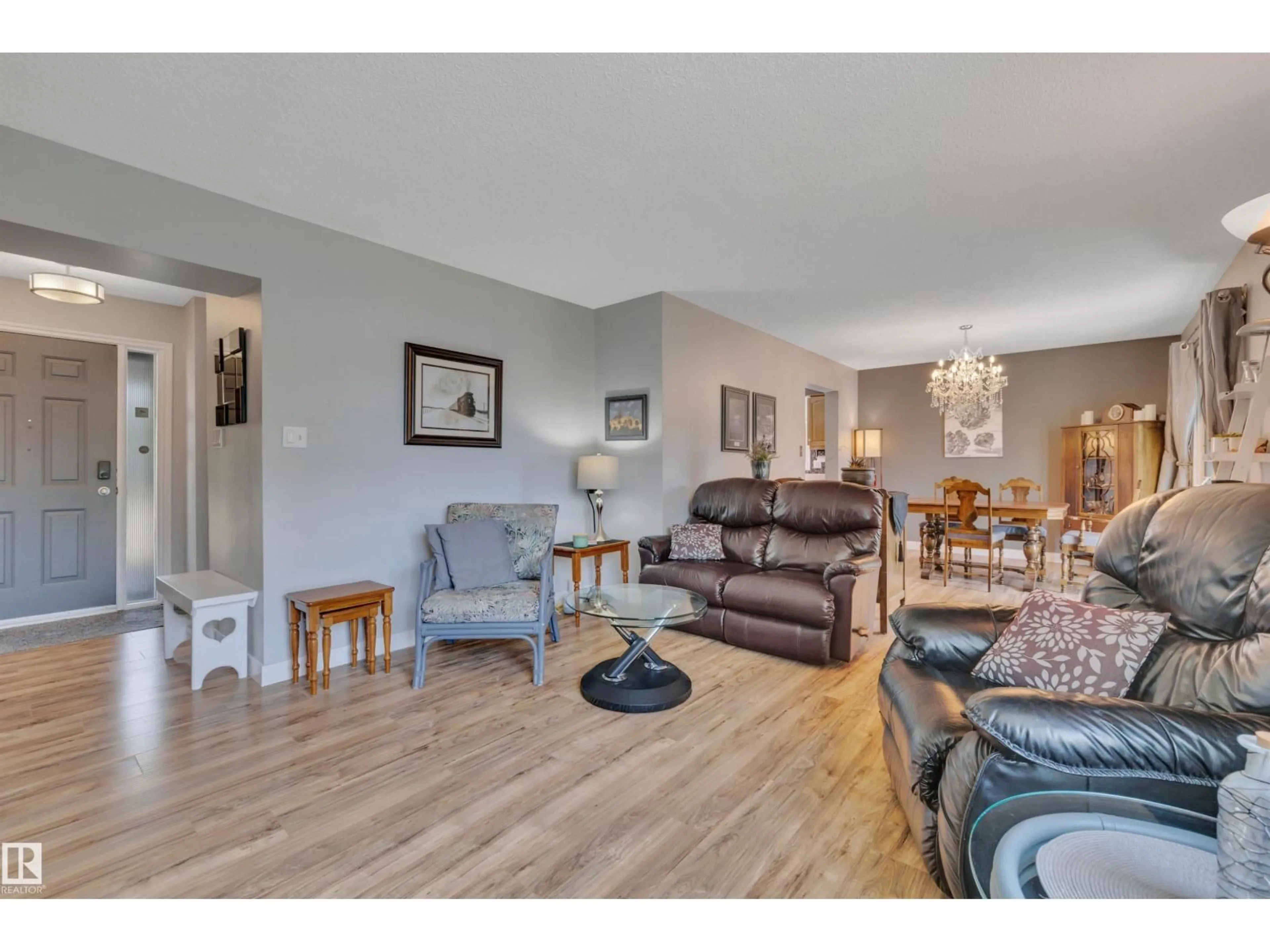 Living room with furniture, wood/laminate floor for NW - 14032 116 ST, Edmonton Alberta T5X3N9