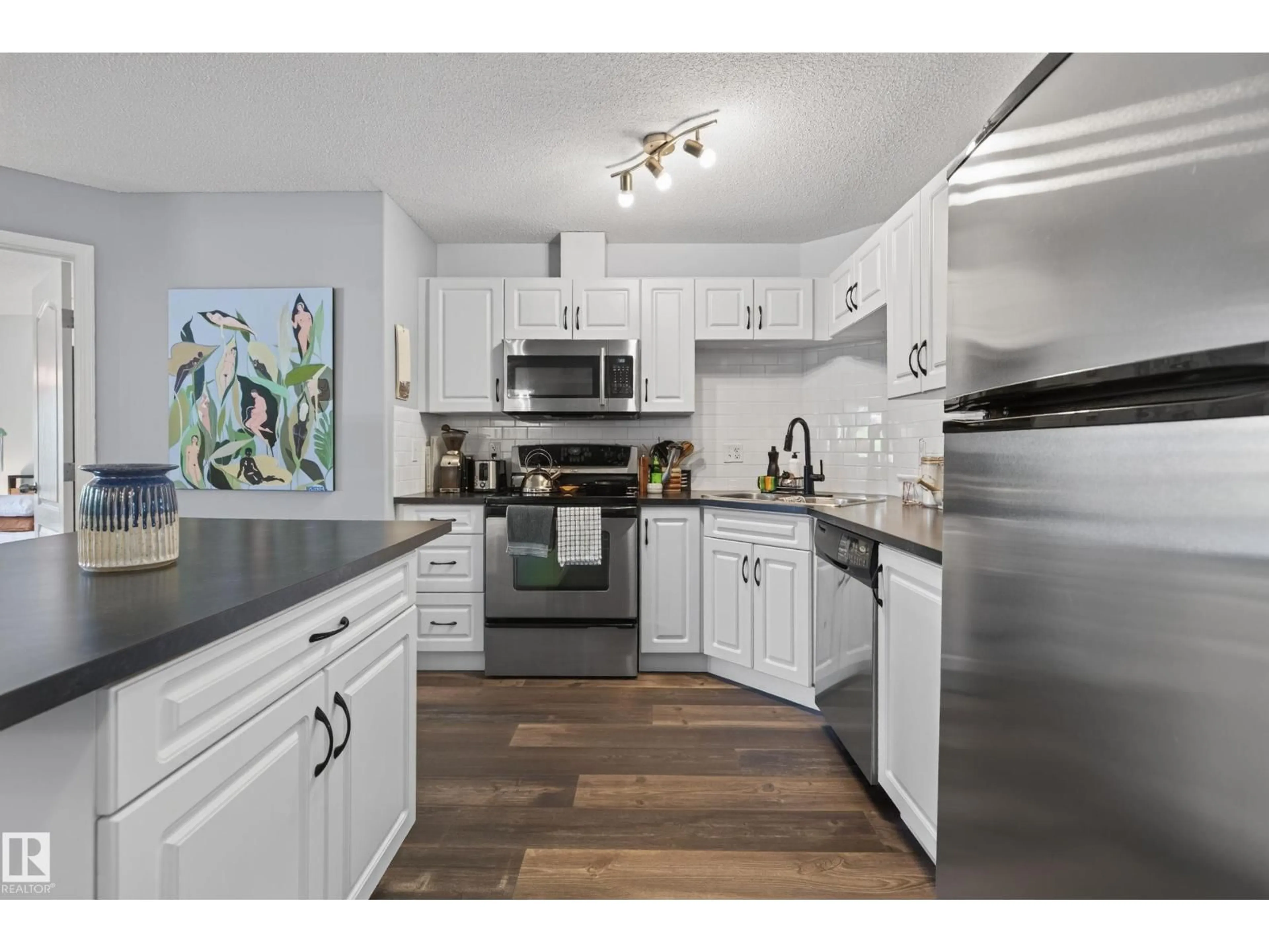 Open concept kitchen, wood/laminate floor for 7327 - 7121 SOUTH TERWILLEGAR DR, Edmonton Alberta T6R0L8