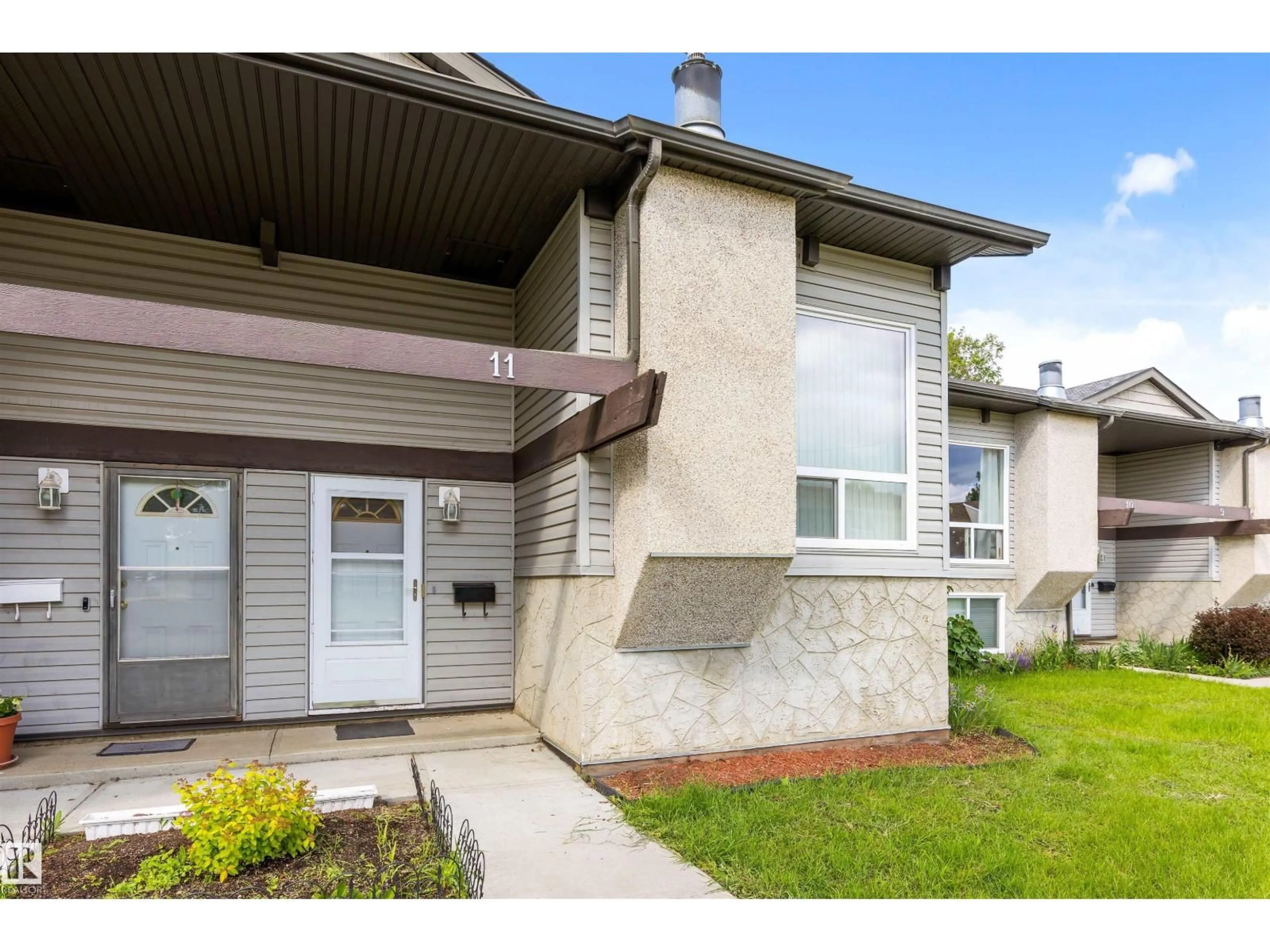 Home with vinyl exterior material, street for 11 NORTHWOODS VG, Edmonton Alberta T5X1T2