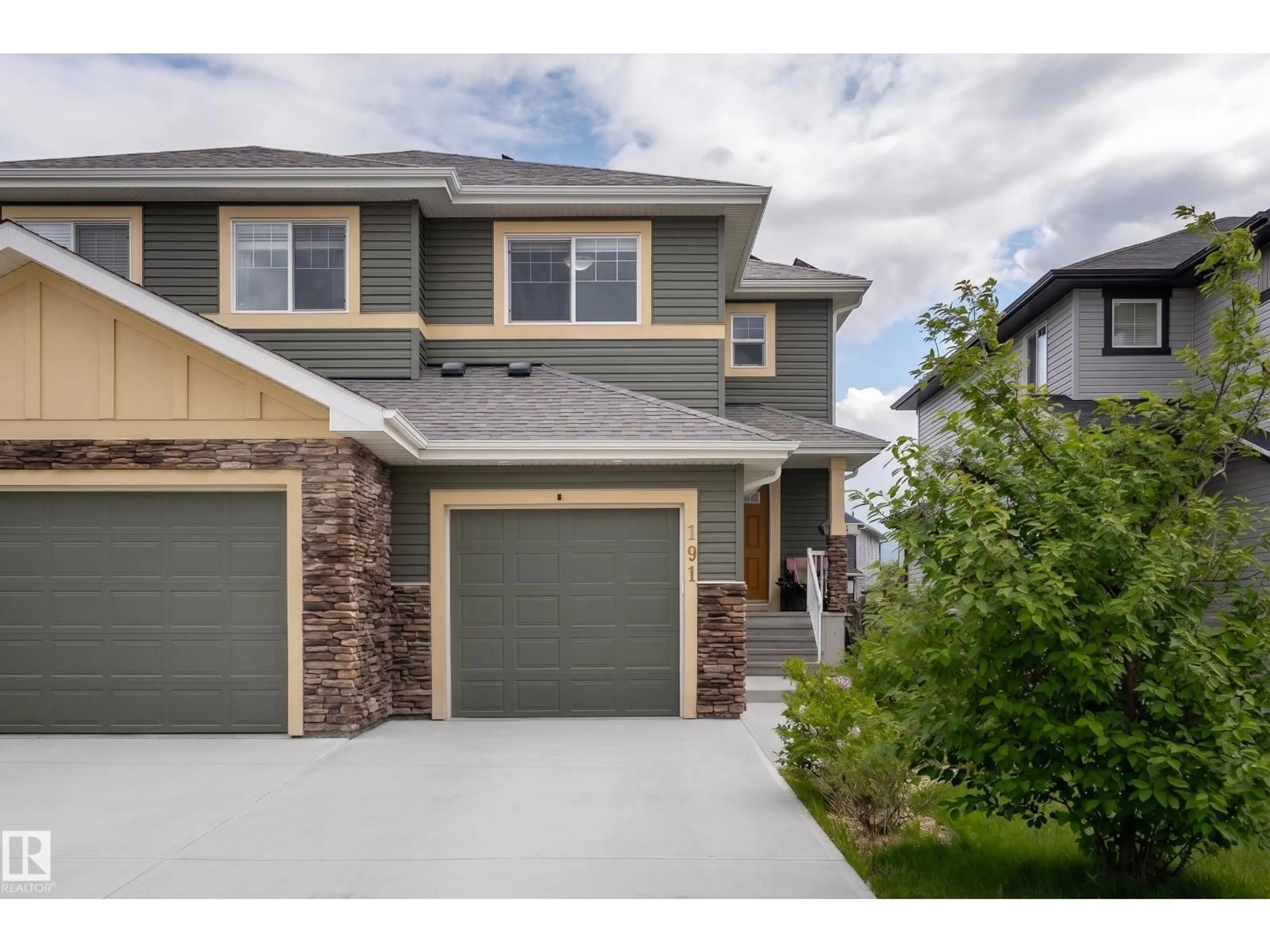 Home with vinyl exterior material, street for 191 REED PLACE, Leduc Alberta T9E0S6