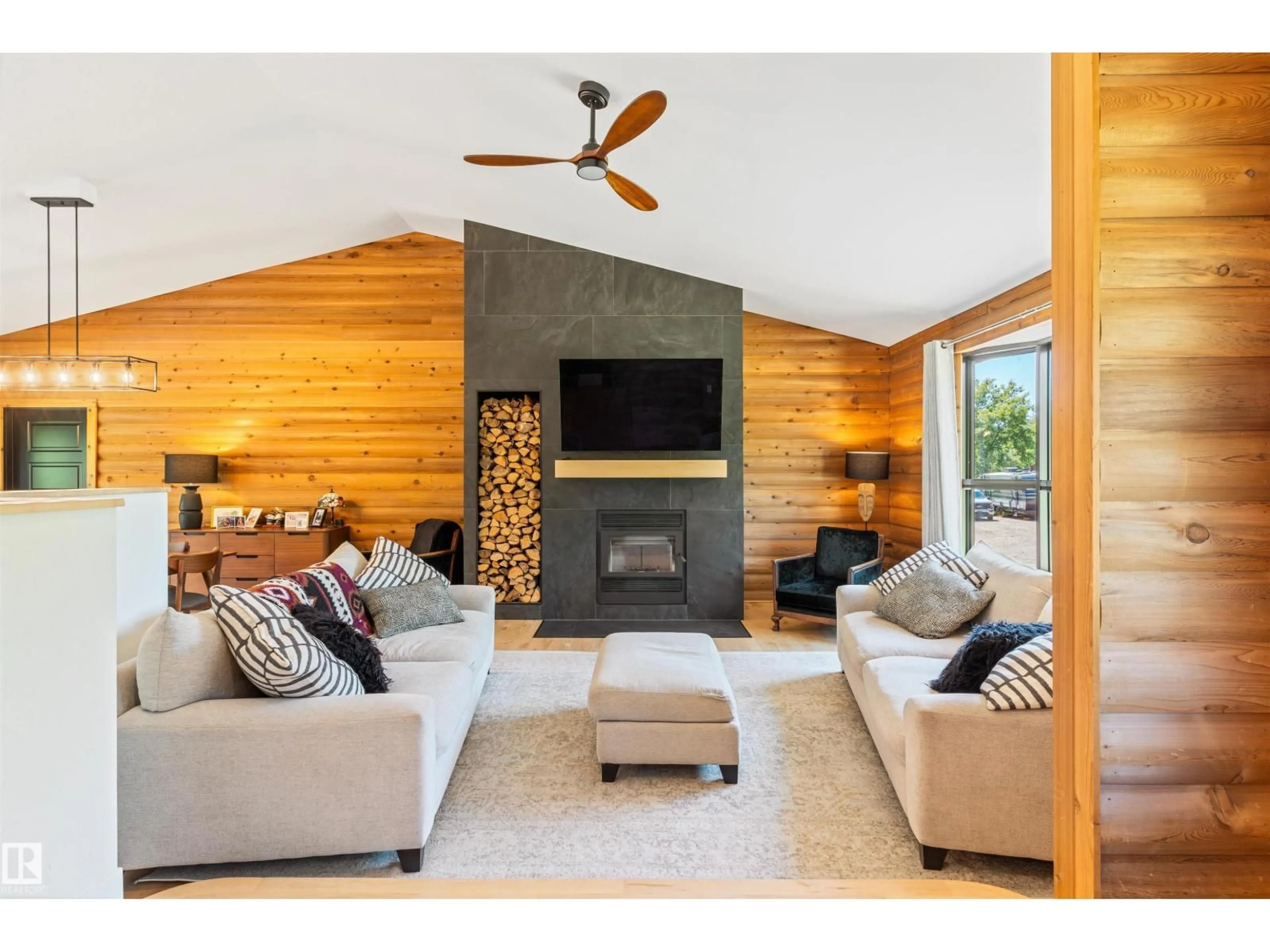 Living room with furniture, wood/laminate floor for 27019 - 107 TWP ROAD 514, Rural Parkland County Alberta T7Y1G6