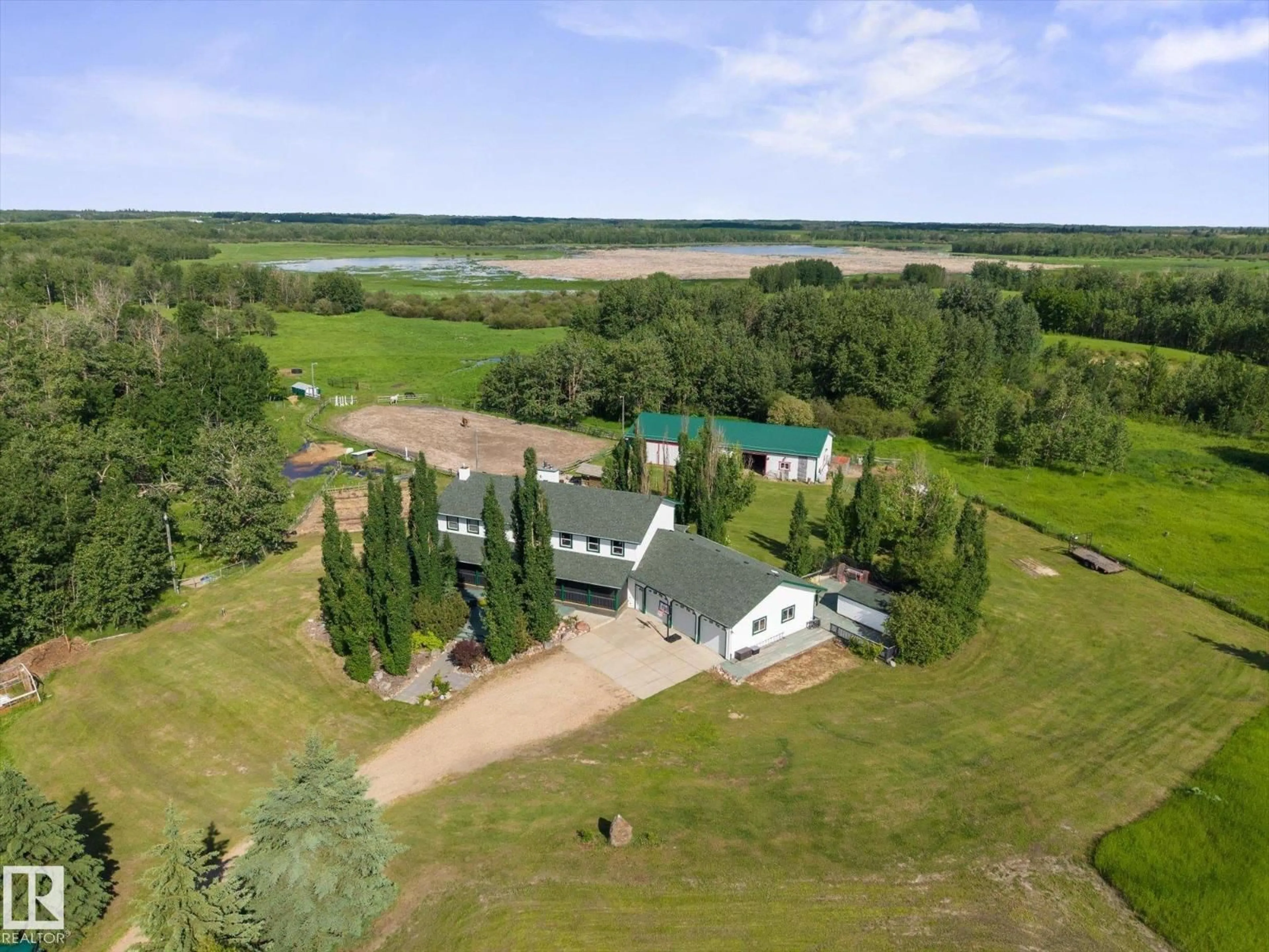 A pic from outside/outdoor area/front of a property/back of a property/a pic from drone, water/lake/river/ocean view for 51559 RGE ROAD 204, Rural Strathcona County Alberta T8G1G3