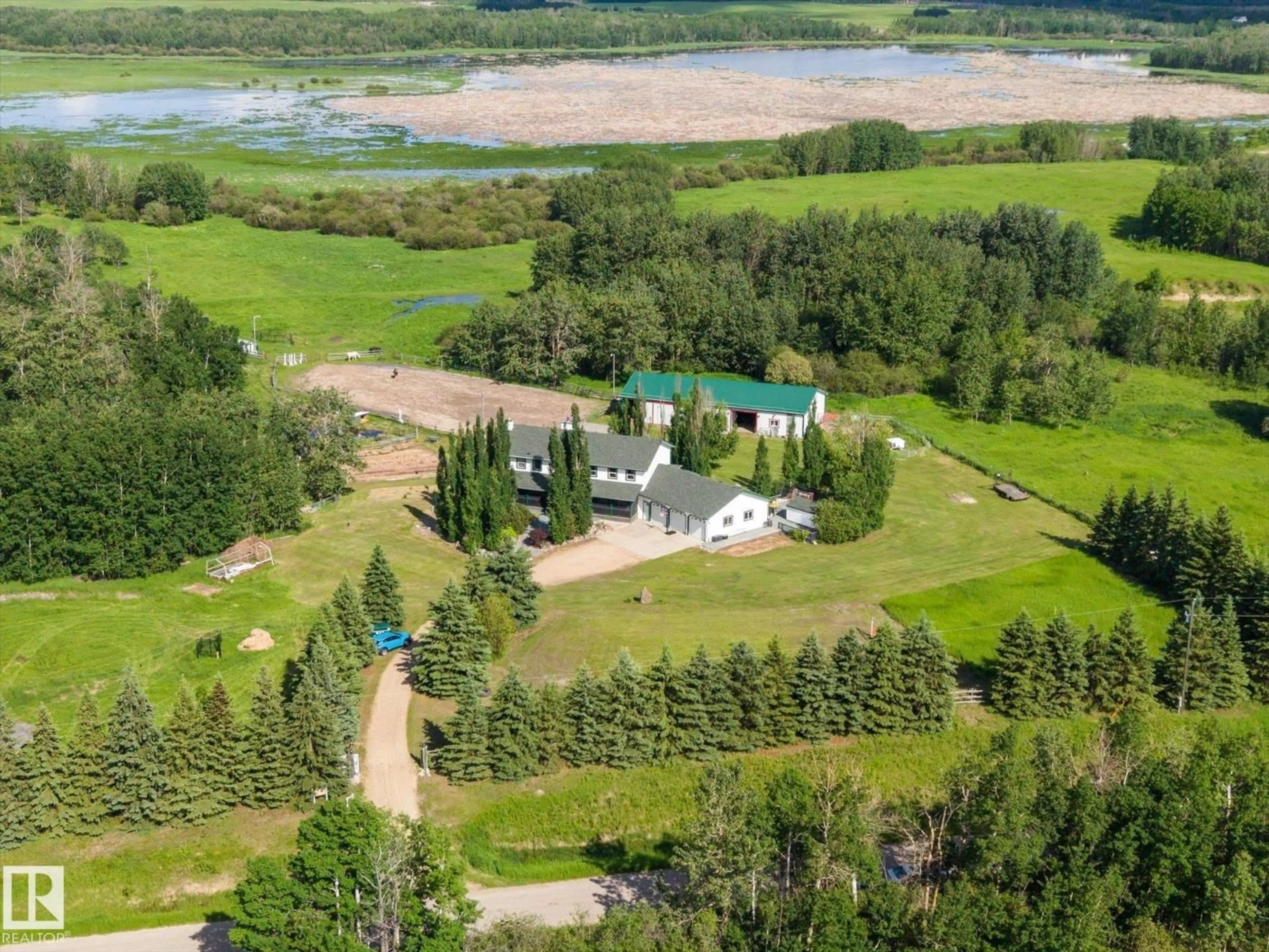 A pic from outside/outdoor area/front of a property/back of a property/a pic from drone, water/lake/river/ocean view for 51559 RGE ROAD 204, Rural Strathcona County Alberta T8G1G3
