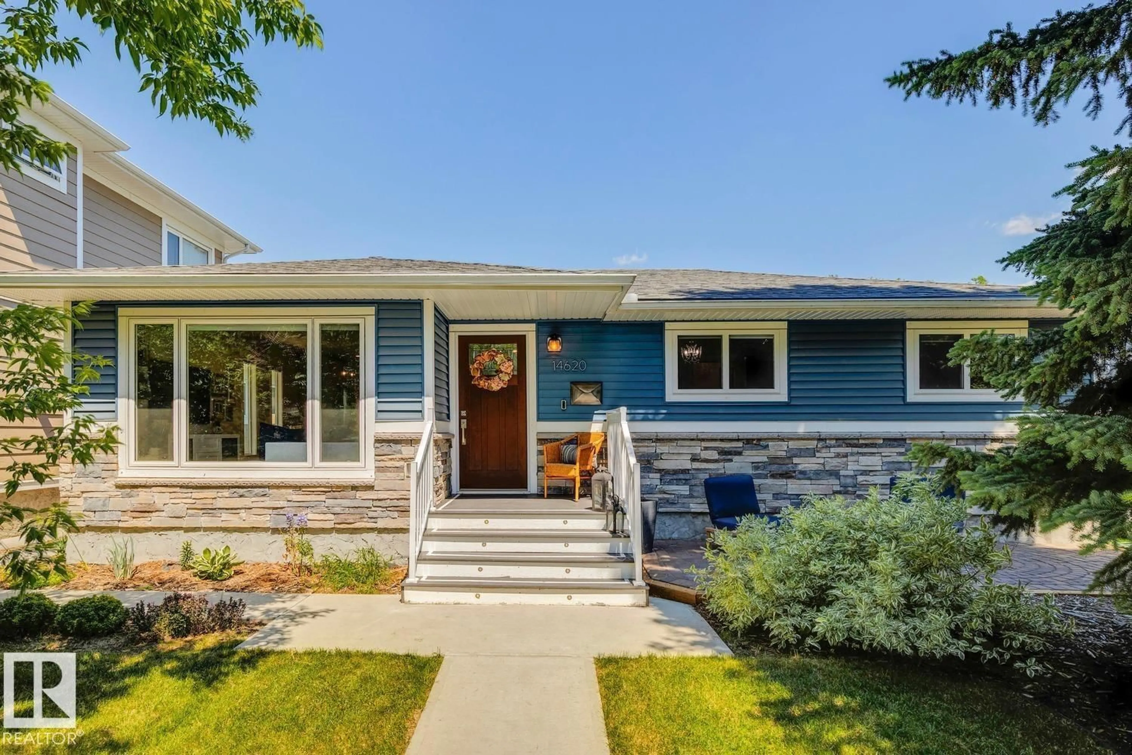 Home with vinyl exterior material, street for 14620 89 AV, Edmonton Alberta T5R4P5