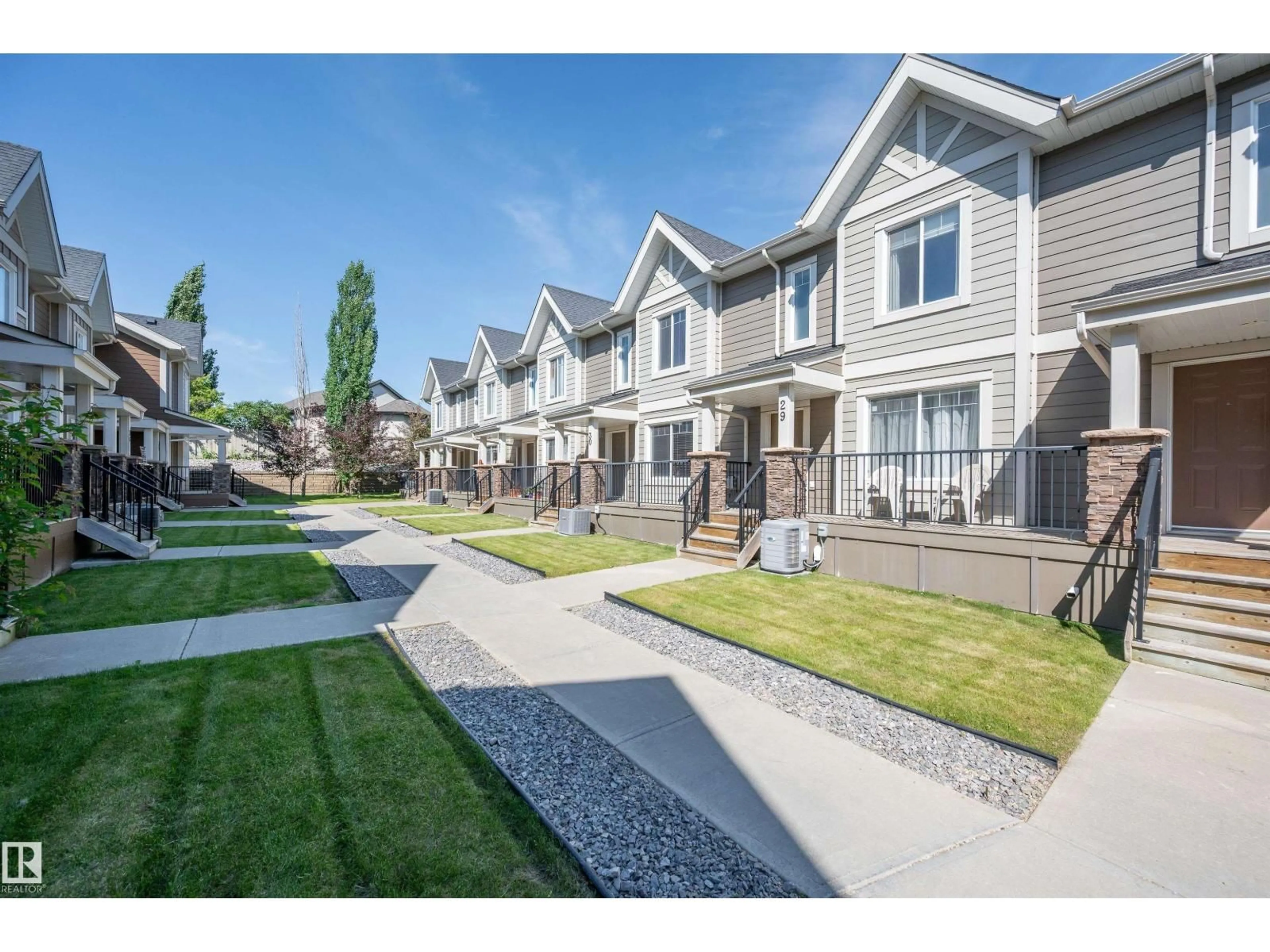 A pic from outside/outdoor area/front of a property/back of a property/a pic from drone, street for 1150 - 29 WINDERMERE WY, Edmonton Alberta T6W2B6