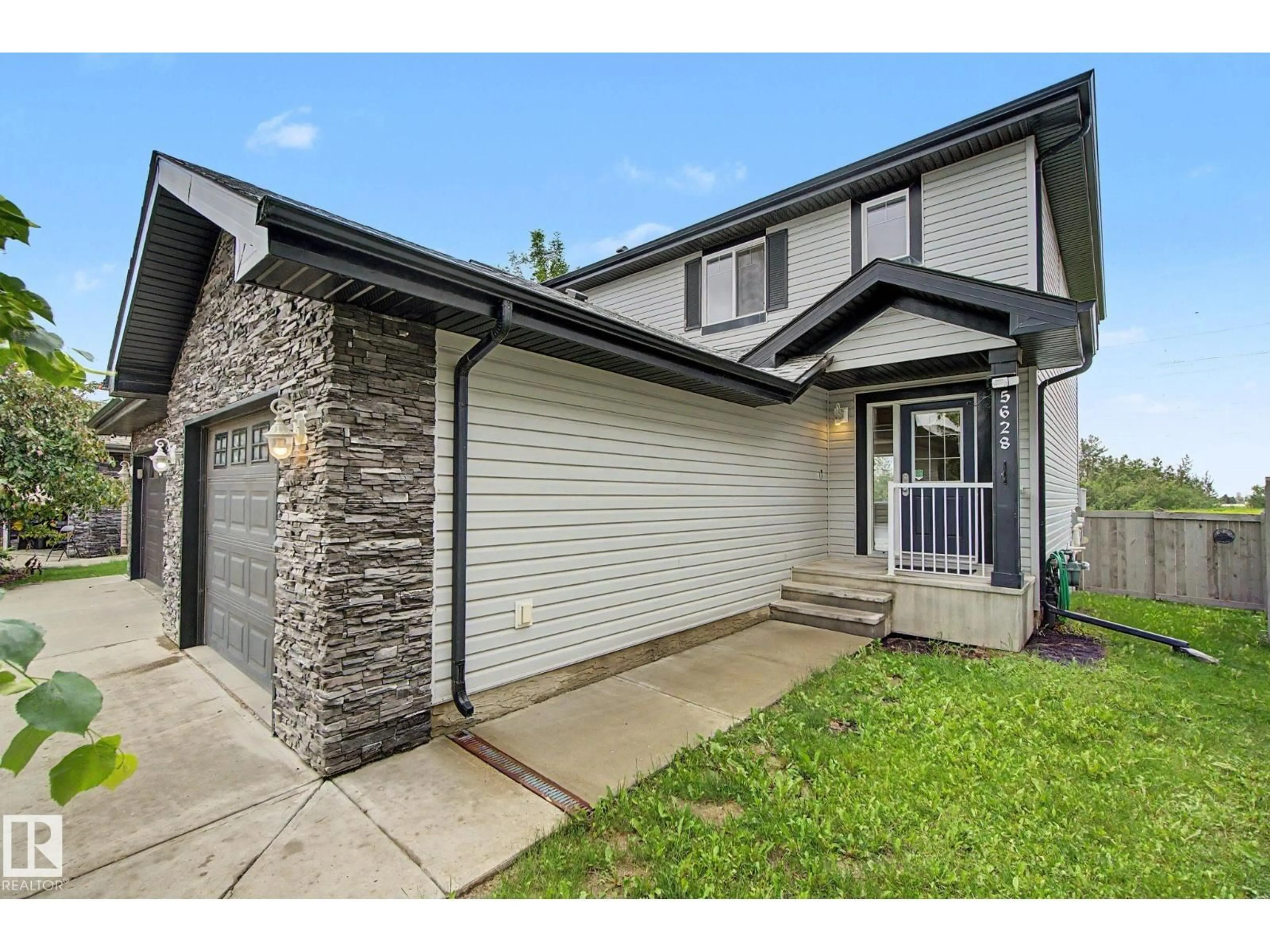 Home with vinyl exterior material, street for SW - 5628 1A AV, Edmonton Alberta T6X0K9