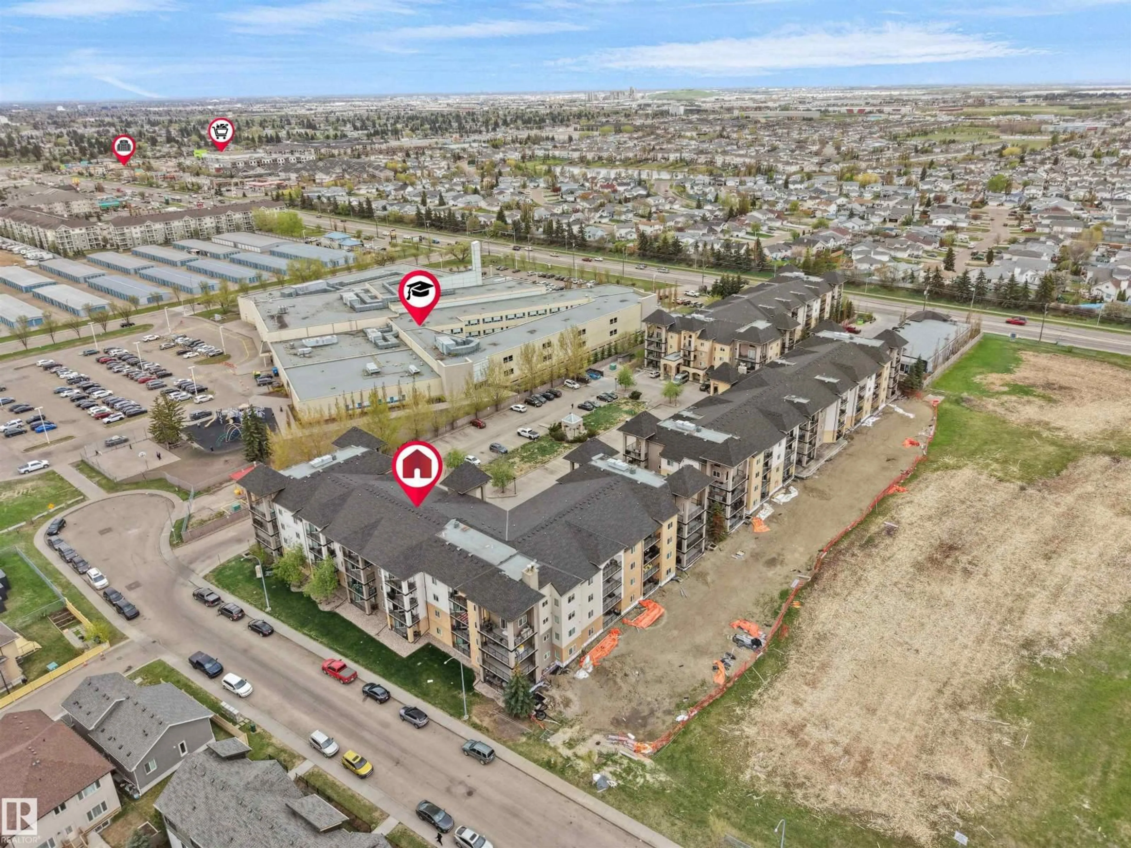 A pic from outside/outdoor area/front of a property/back of a property/a pic from drone, street for #104 - 14612 125 ST, Edmonton Alberta T5X0B6