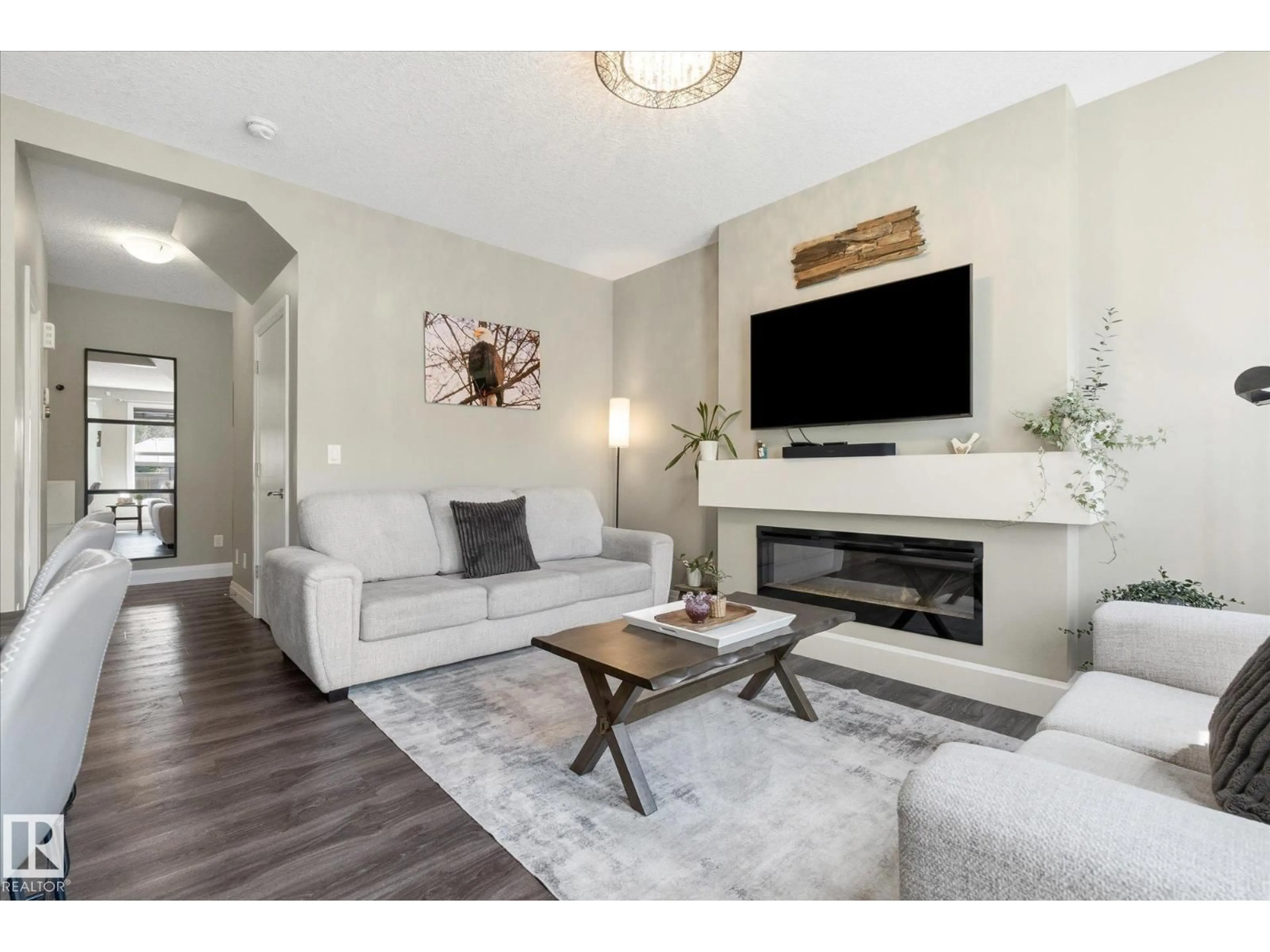 Living room with furniture, wood/laminate floor for 73 SPRINGWOOD WY, Spruce Grove Alberta T7X0S8