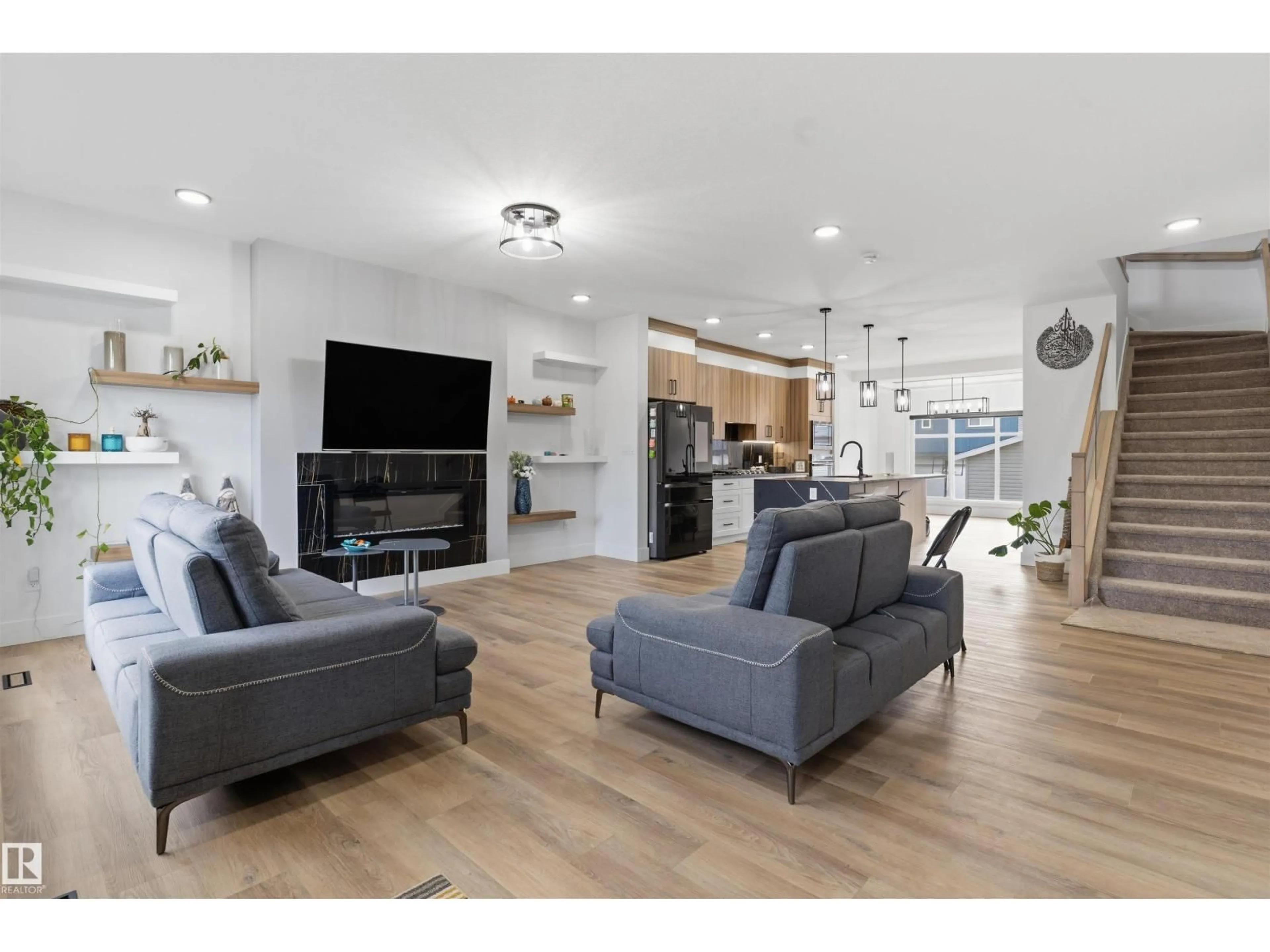 Living room with furniture, wood/laminate floor for 4373 37 ST, Beaumont Alberta T4X3A7