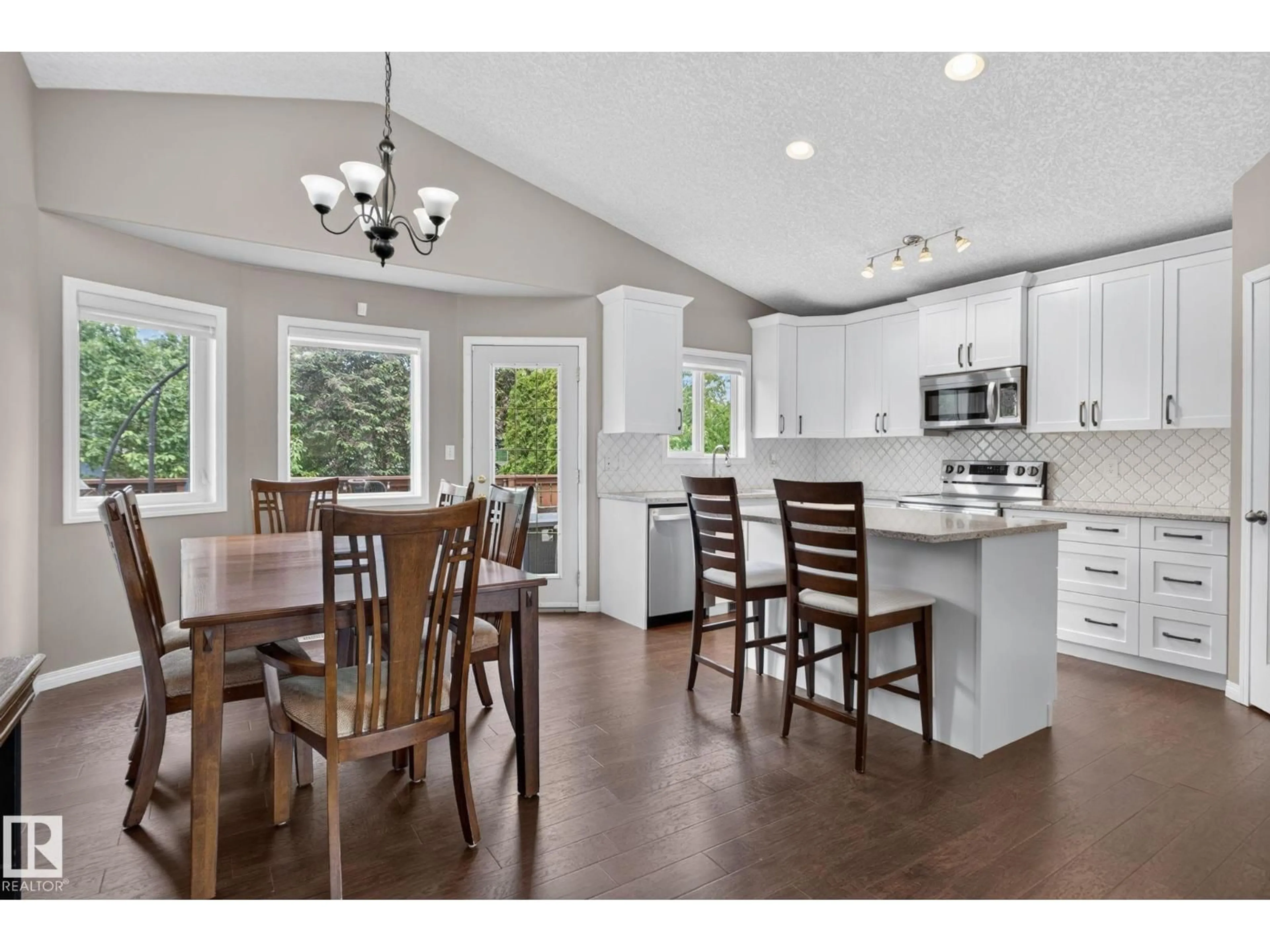 Open concept kitchen, wood/laminate floor for NW - 4914 152A AV, Edmonton Alberta T5Y3C1