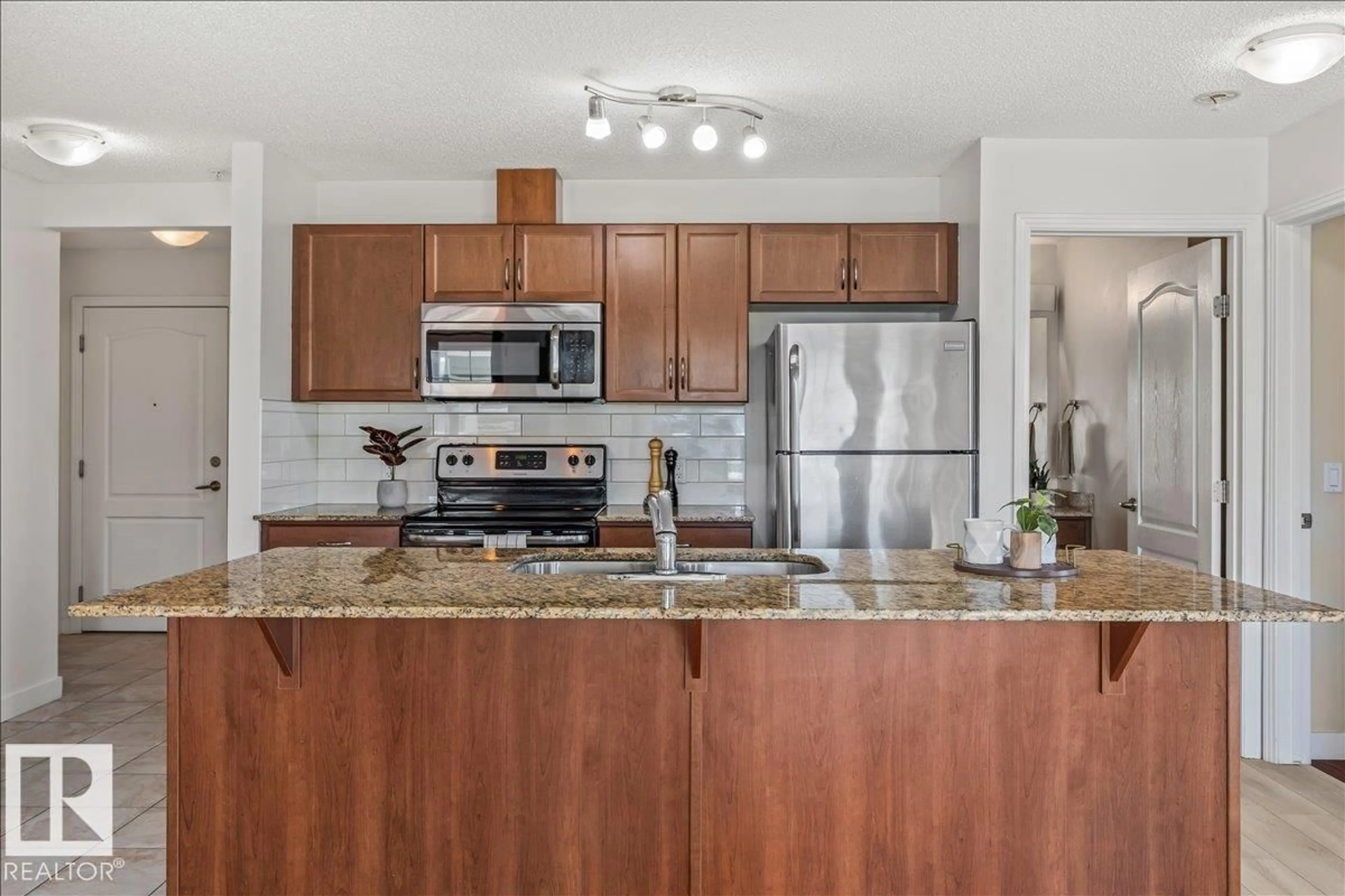 Open concept kitchen, unknown for 114 - 12650 142 AV, Edmonton Alberta T5X0J5