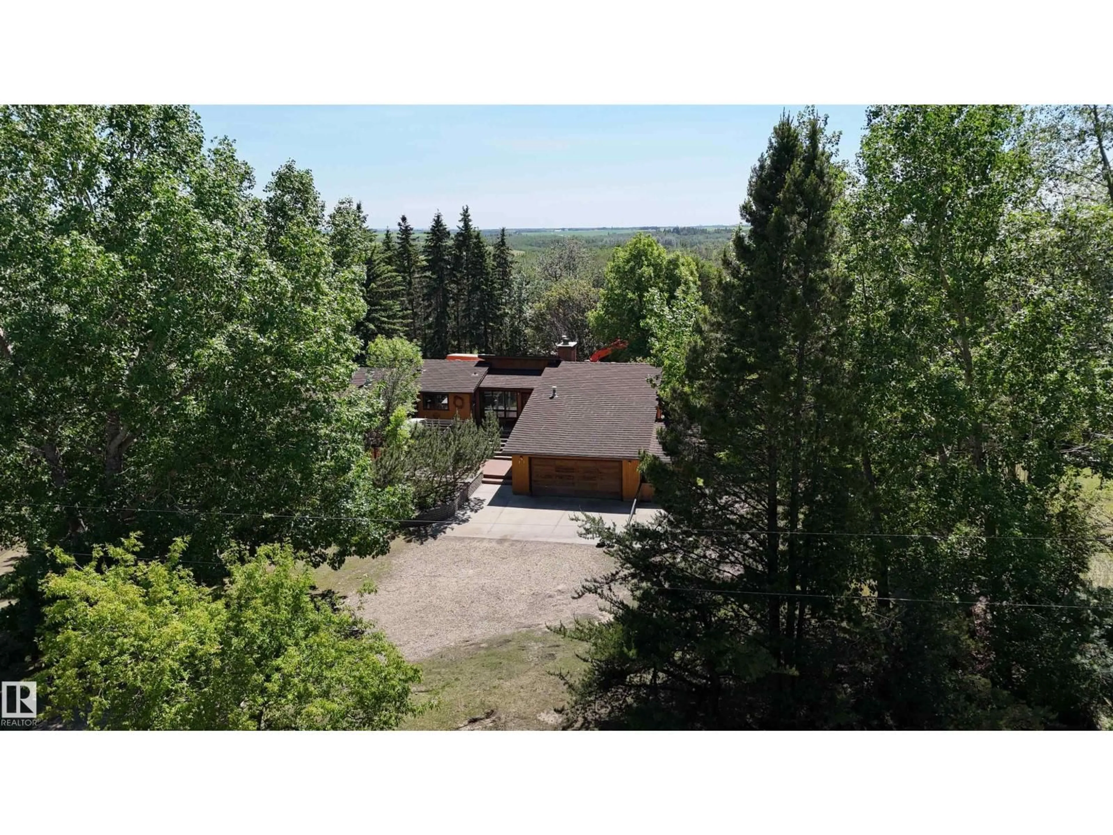 A pic from outside/outdoor area/front of a property/back of a property/a pic from drone, forest/trees view for #47 - 24213 TWP ROAD 554, Rural Sturgeon County Alberta T0A2N0