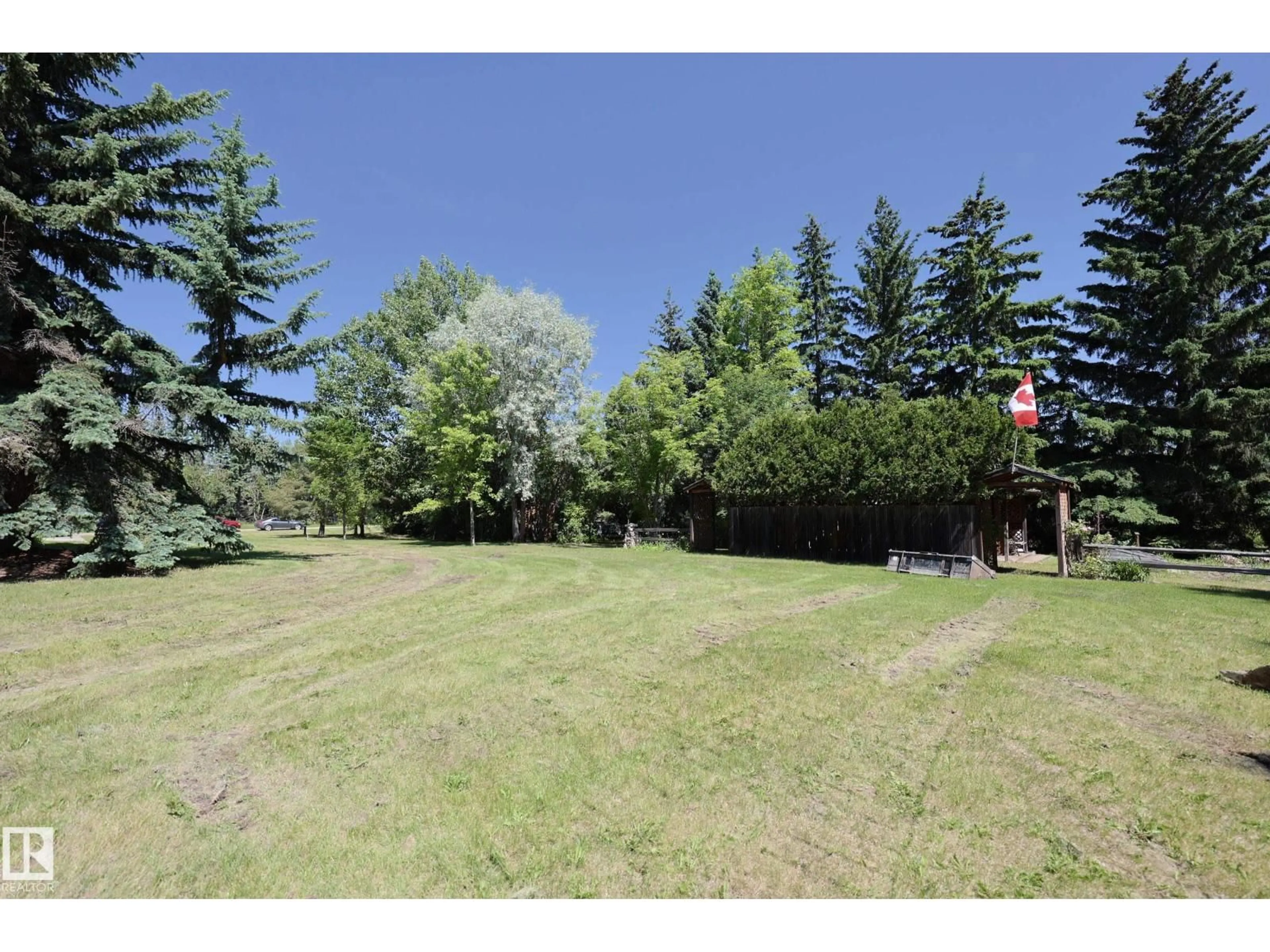 A pic from outside/outdoor area/front of a property/back of a property/a pic from drone, forest/trees view for #47 - 24213 TWP ROAD 554, Rural Sturgeon County Alberta T0A2N0