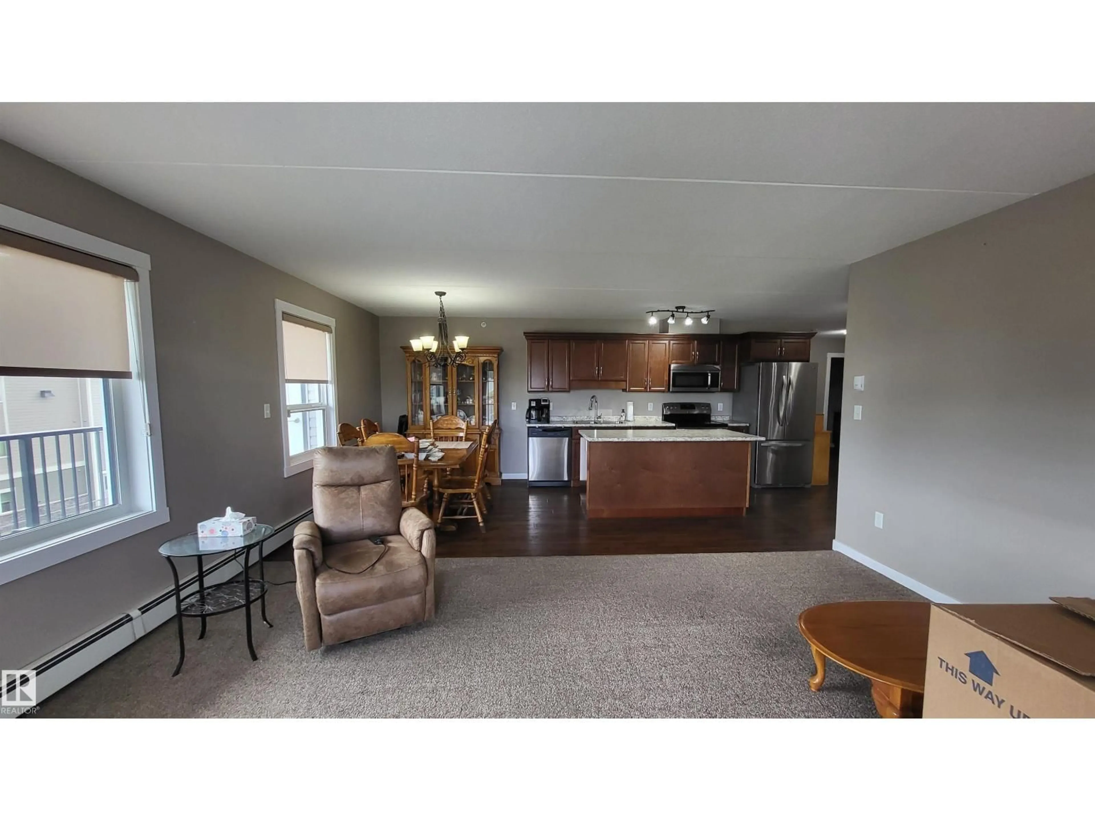 Open concept kitchen, wood/laminate floor for 303 - 4002 47 ST, Drayton Valley Alberta T7A0A2