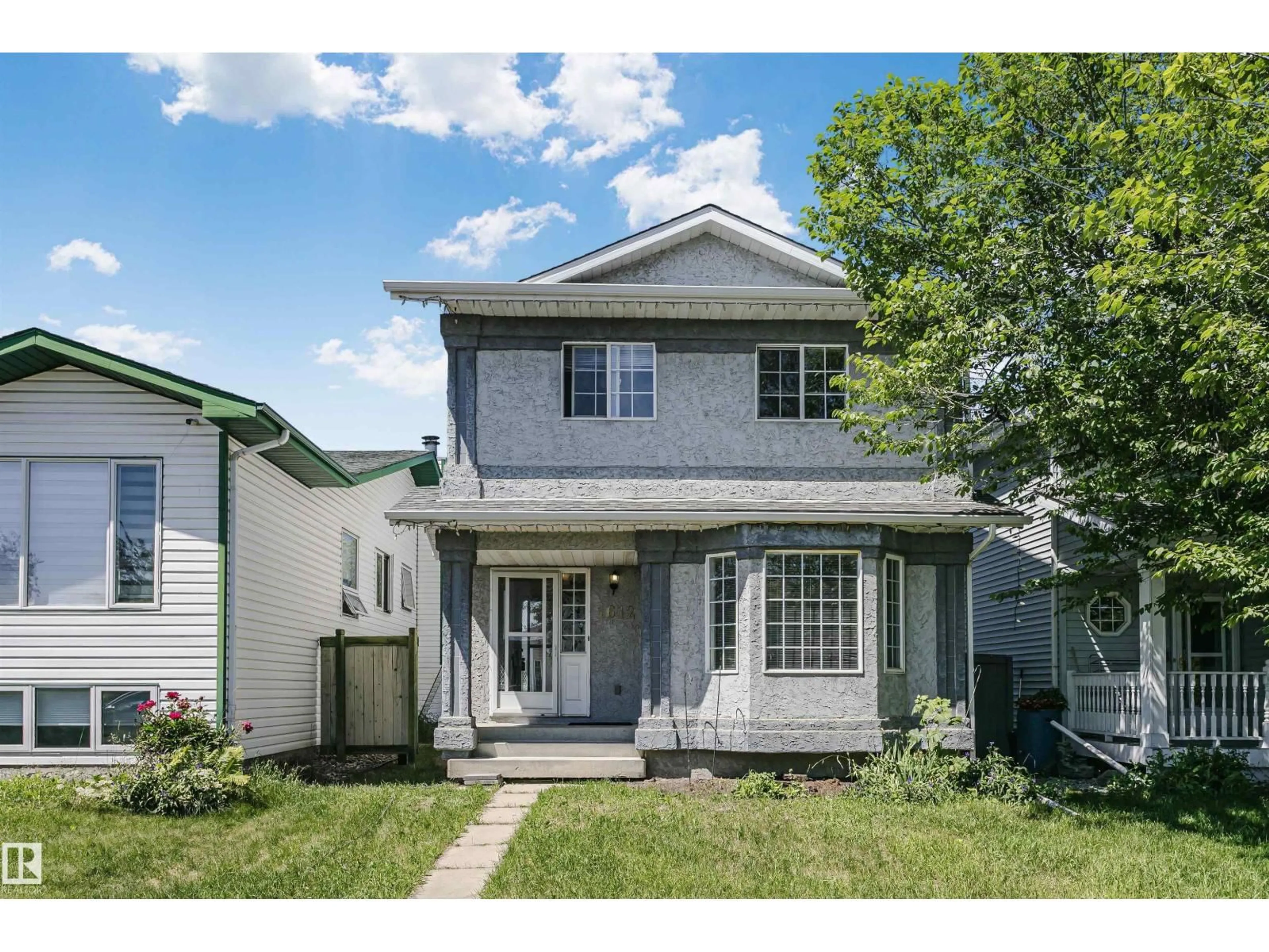 Home with vinyl exterior material, street for NW - 1612 80A ST, Edmonton Alberta T6K4E1