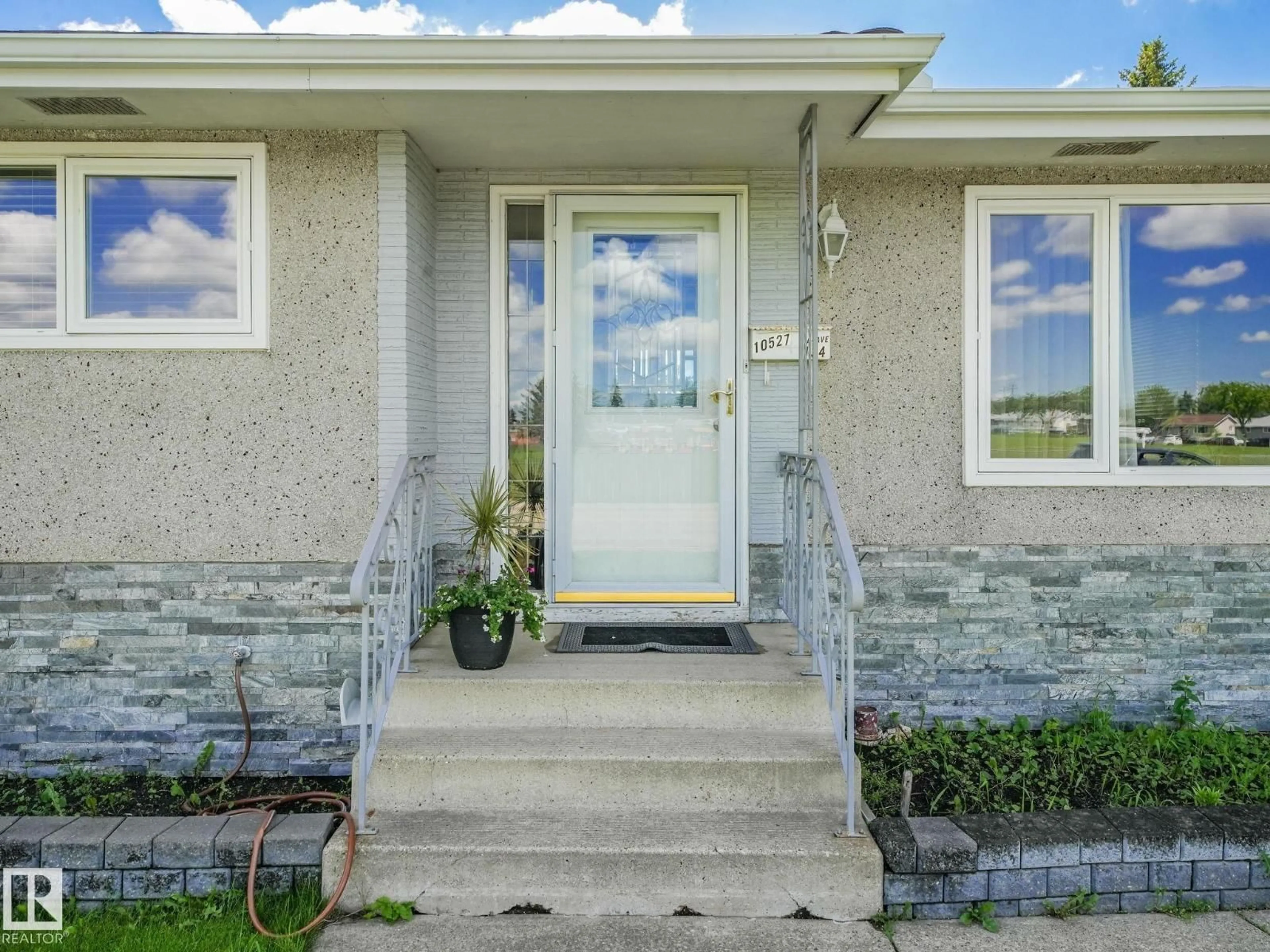 Home with vinyl exterior material, street for 10527 134A AV, Edmonton Alberta T5E1M1