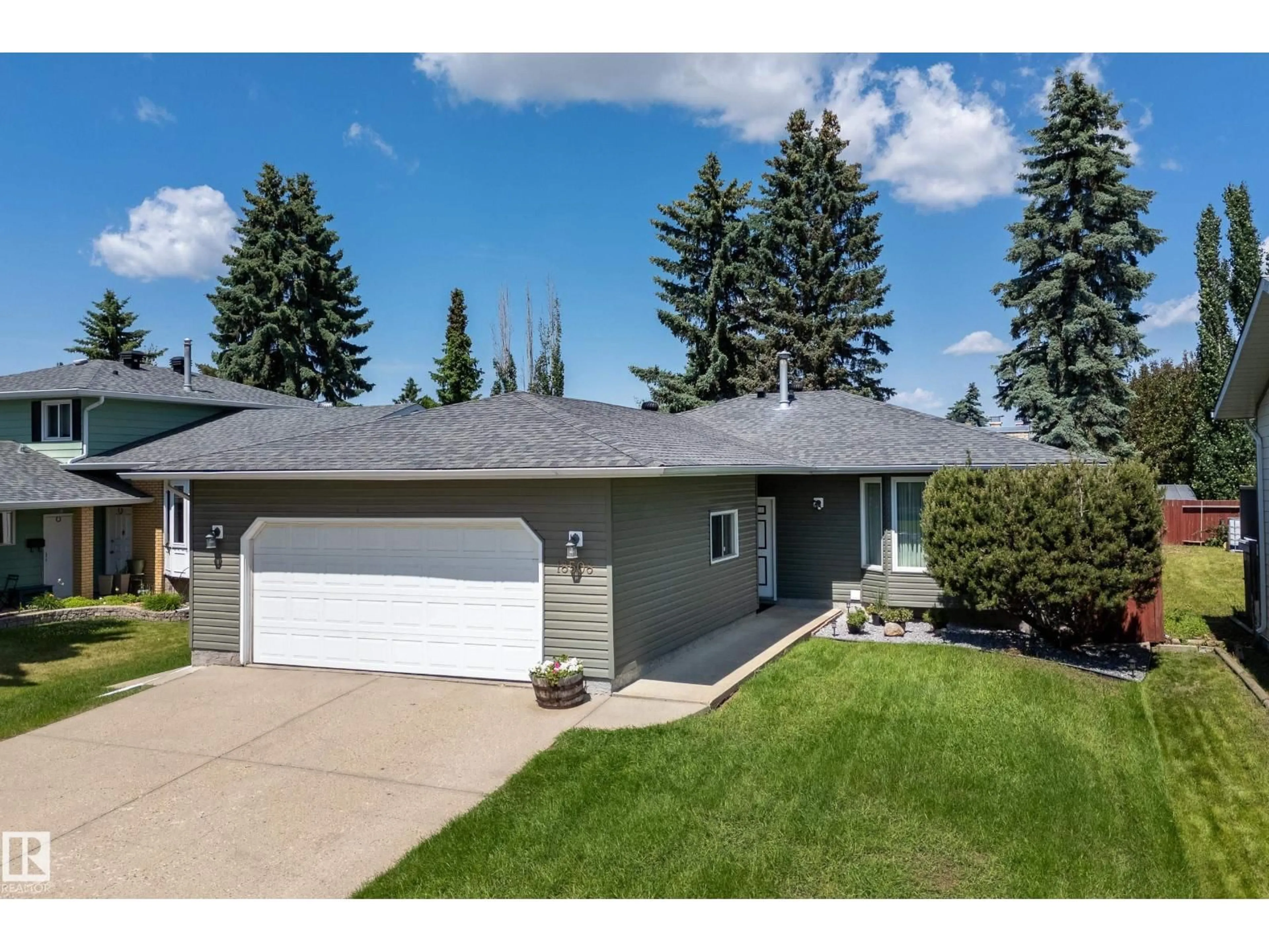 Home with vinyl exterior material, street for 18508 92 AV, Edmonton Alberta T5T1P4