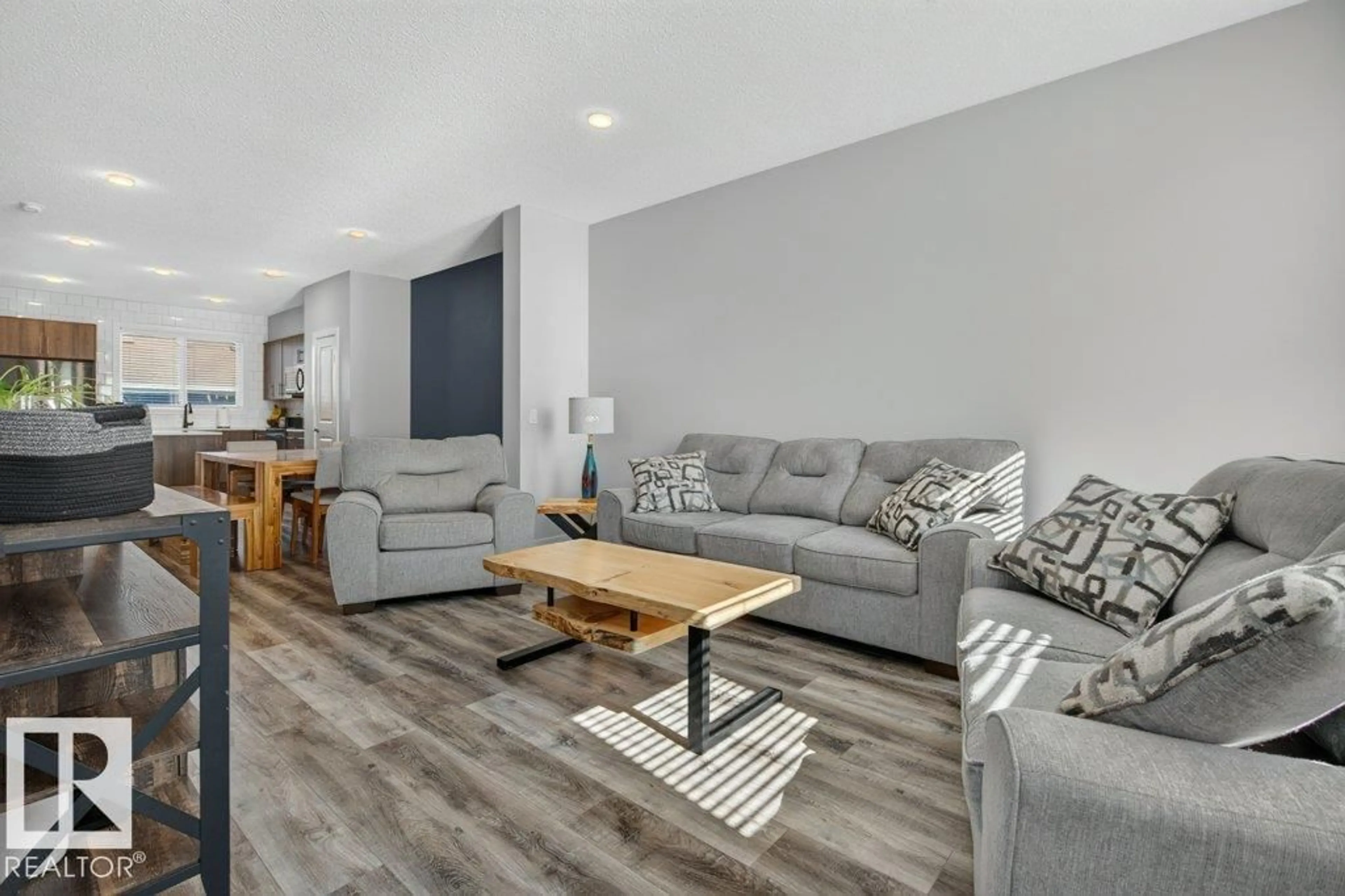 Living room with furniture, wood/laminate floor for 2116 MAPLE RD, Edmonton Alberta T6T2L6
