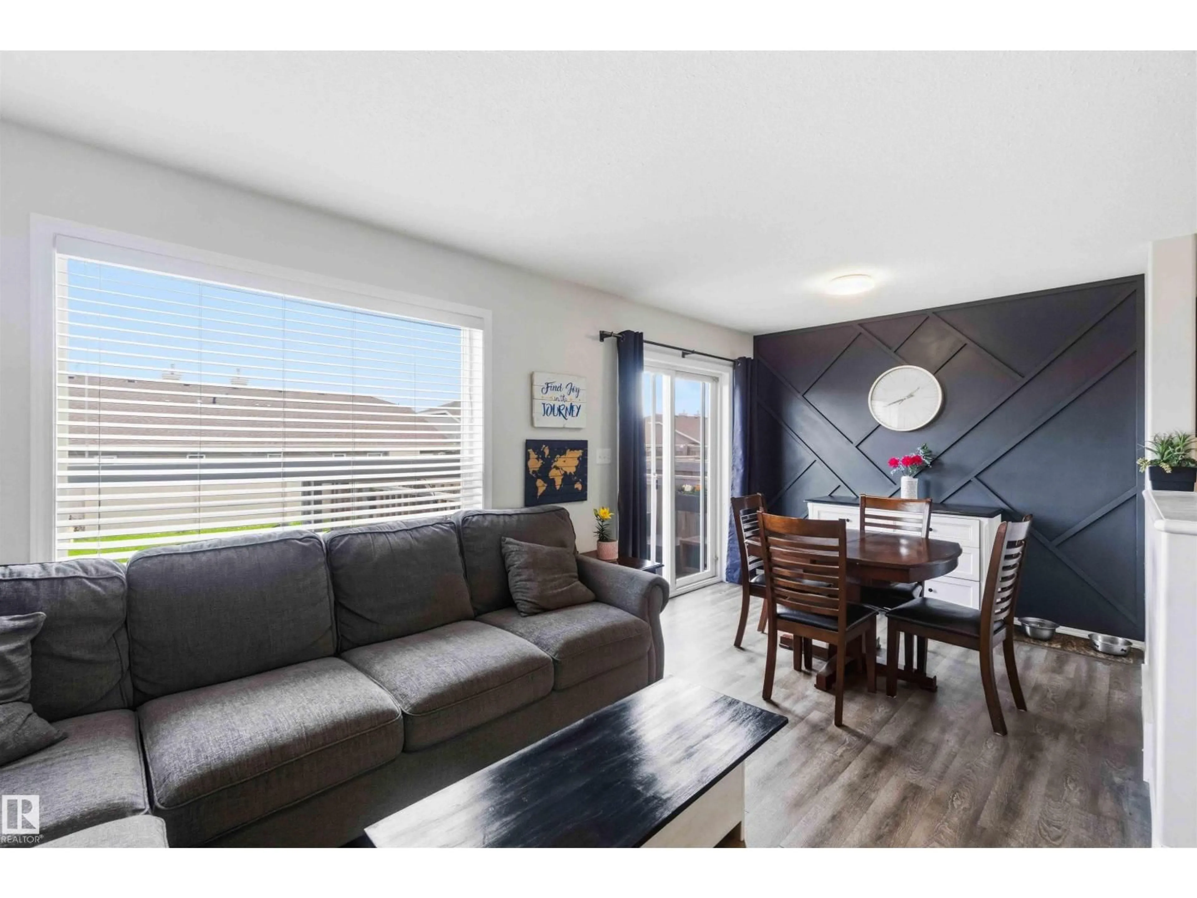 Living room with furniture, wood/laminate floor for 123 GALLOWAY WD, Fort Saskatchewan Alberta T8L0B9