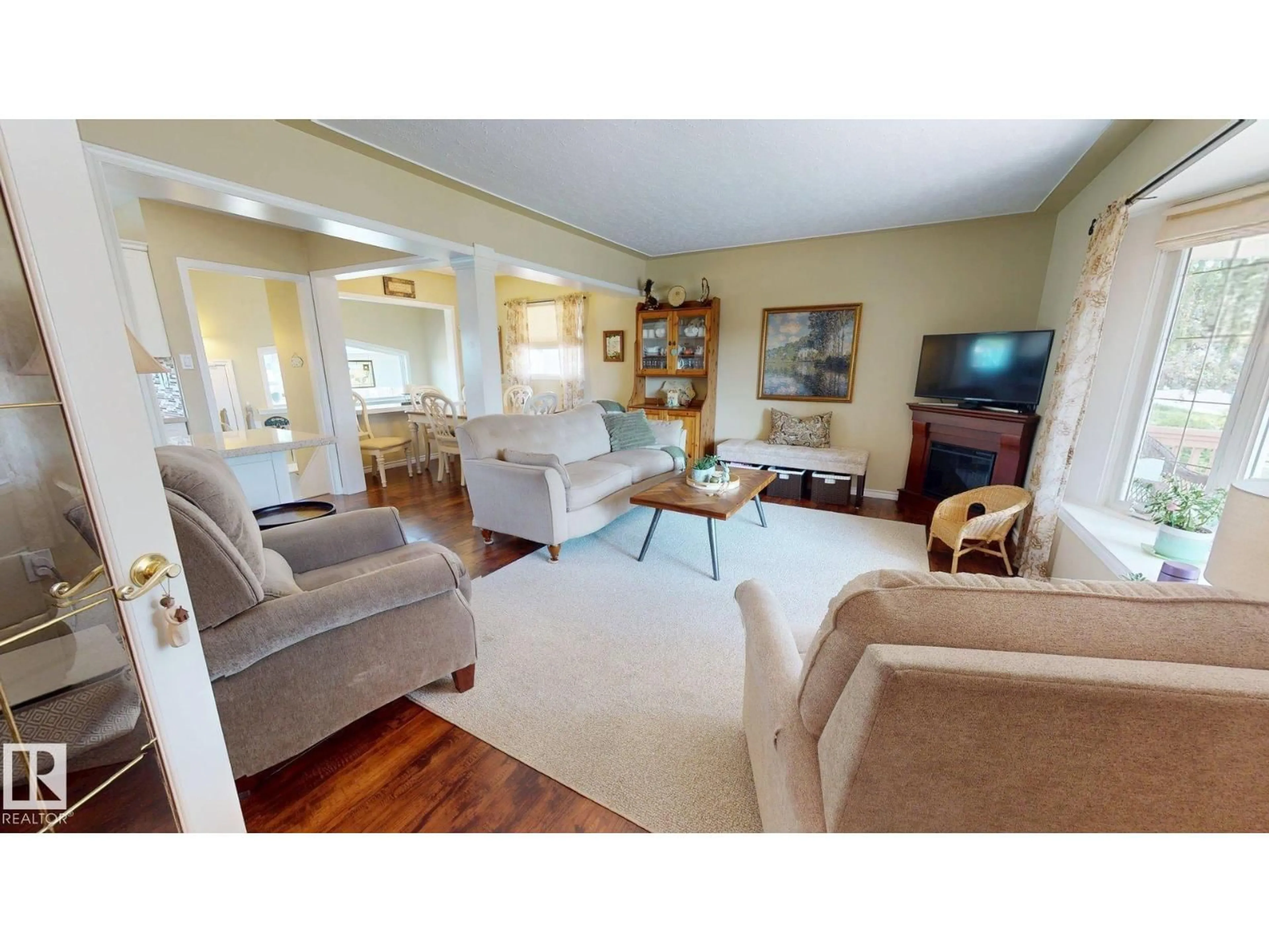 Living room with furniture, wood/laminate floor for 5304 95 AV NW, Edmonton Alberta T6B1A3