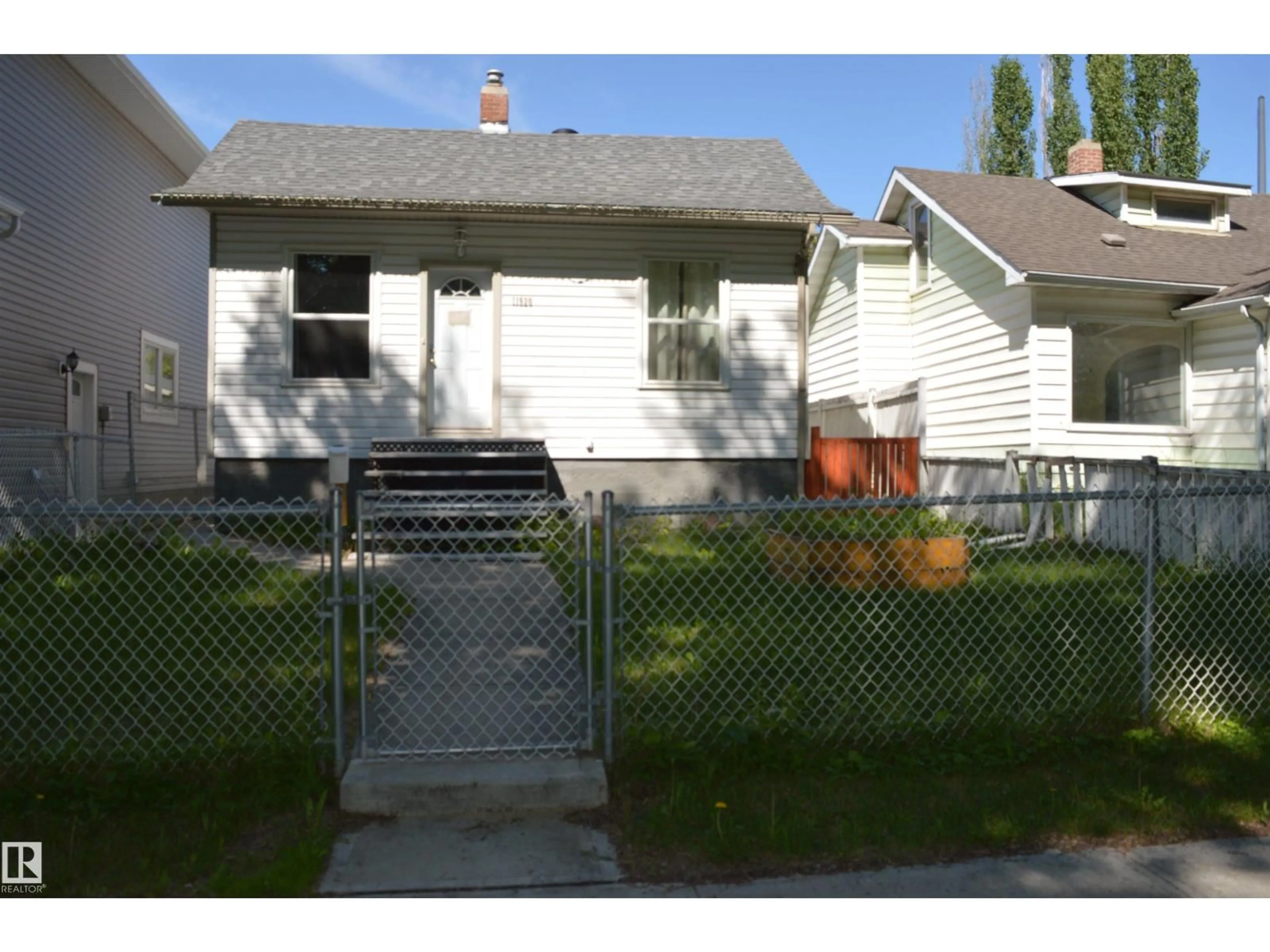Home with vinyl exterior material, street for 11920 78 ST, Edmonton Alberta T5B2J5