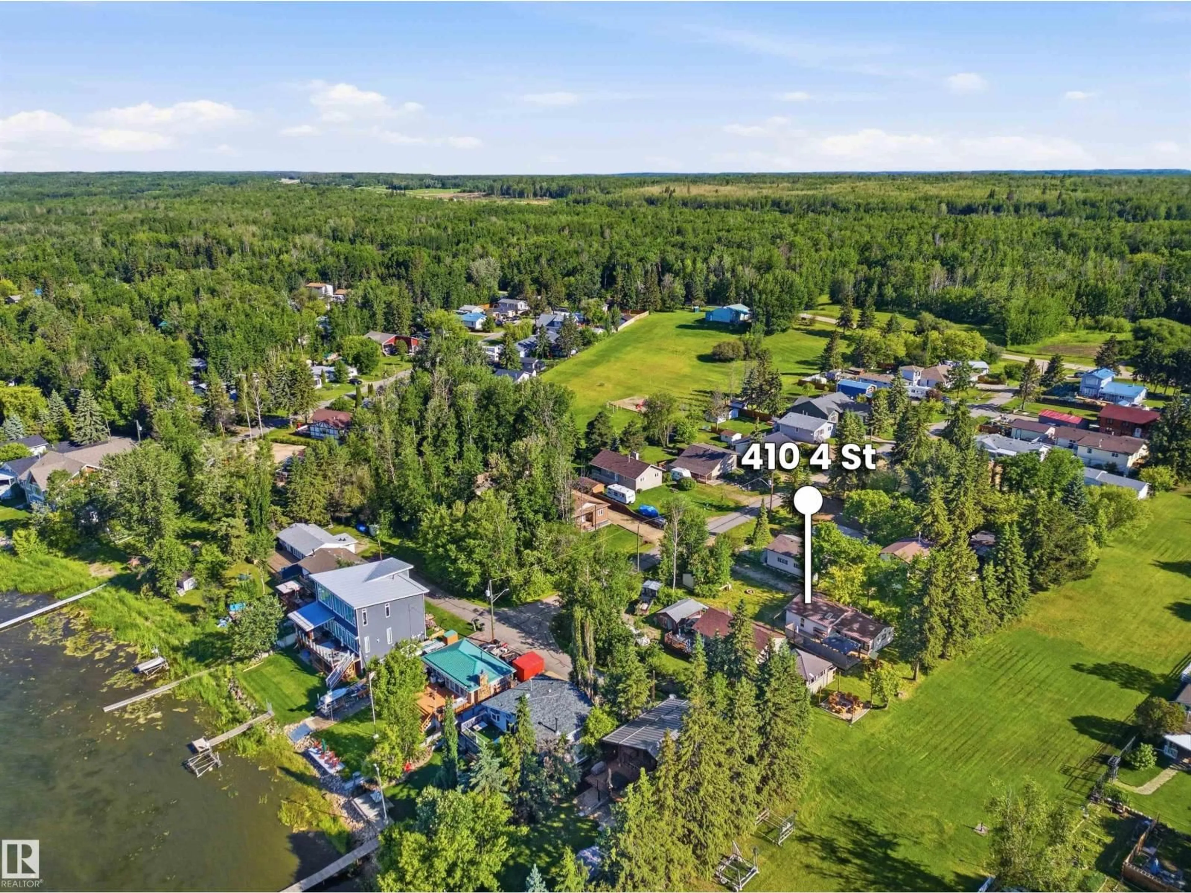 A pic from outside/outdoor area/front of a property/back of a property/a pic from drone, water/lake/river/ocean view for 410 4 ST, Rural Lac Ste. Anne County Alberta T0E1A0